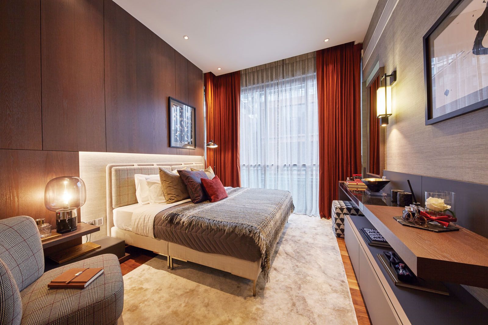 Crimson accents create a youthful vibe in the junior master bedroom;