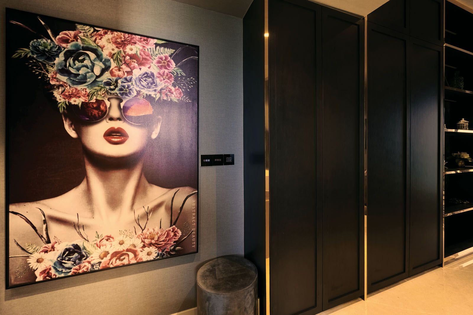 A large artwork creates a focal point at the entrance of the home