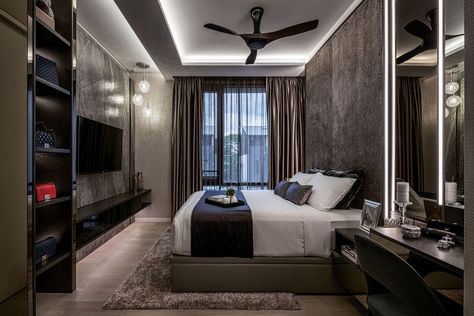 In this bedroom, a special display cabinet holds the owner’s prized collection of handbags, open to admiration and easy accessibility