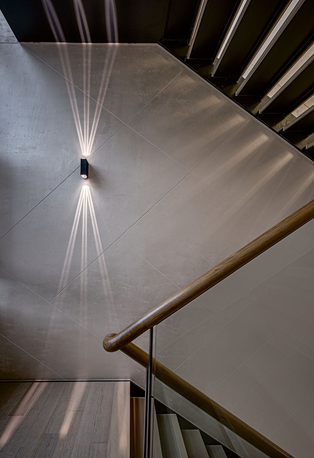 Built-in lighting features create visual interest at the entrance to the basement