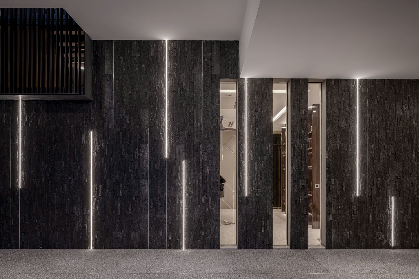 The Travertino Romano wall feature is applied to the stairwell from the basement up to the attic