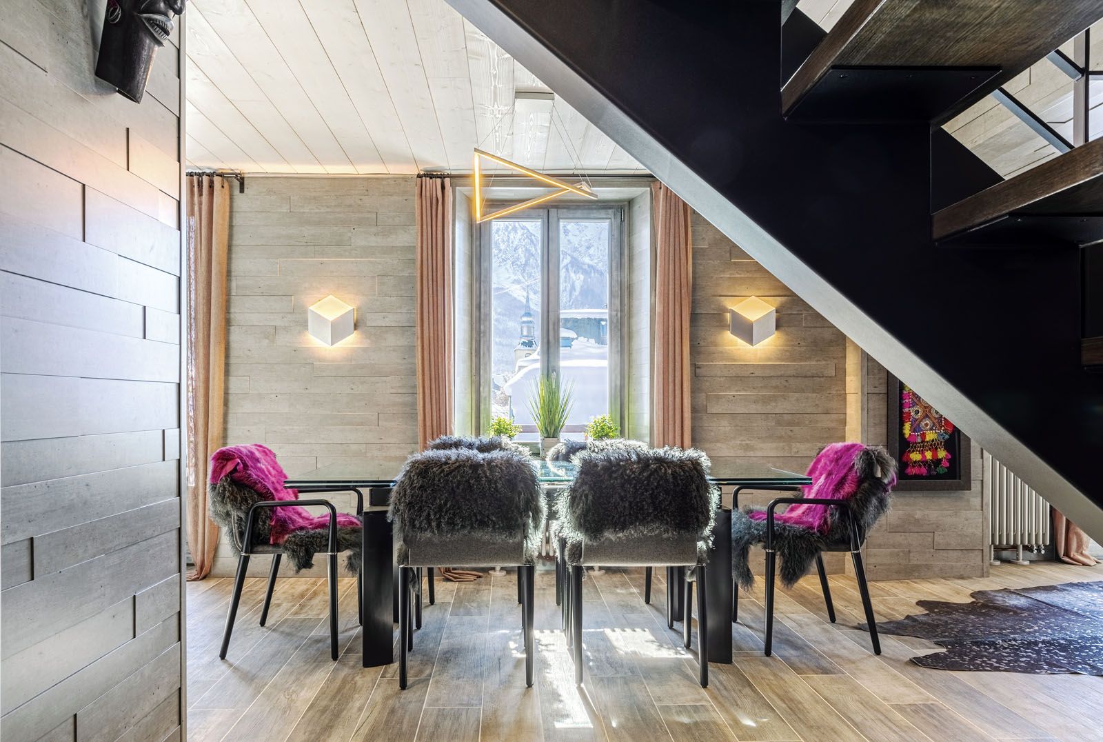 Fur throws on the chairs add a cosy to touch to the dining area