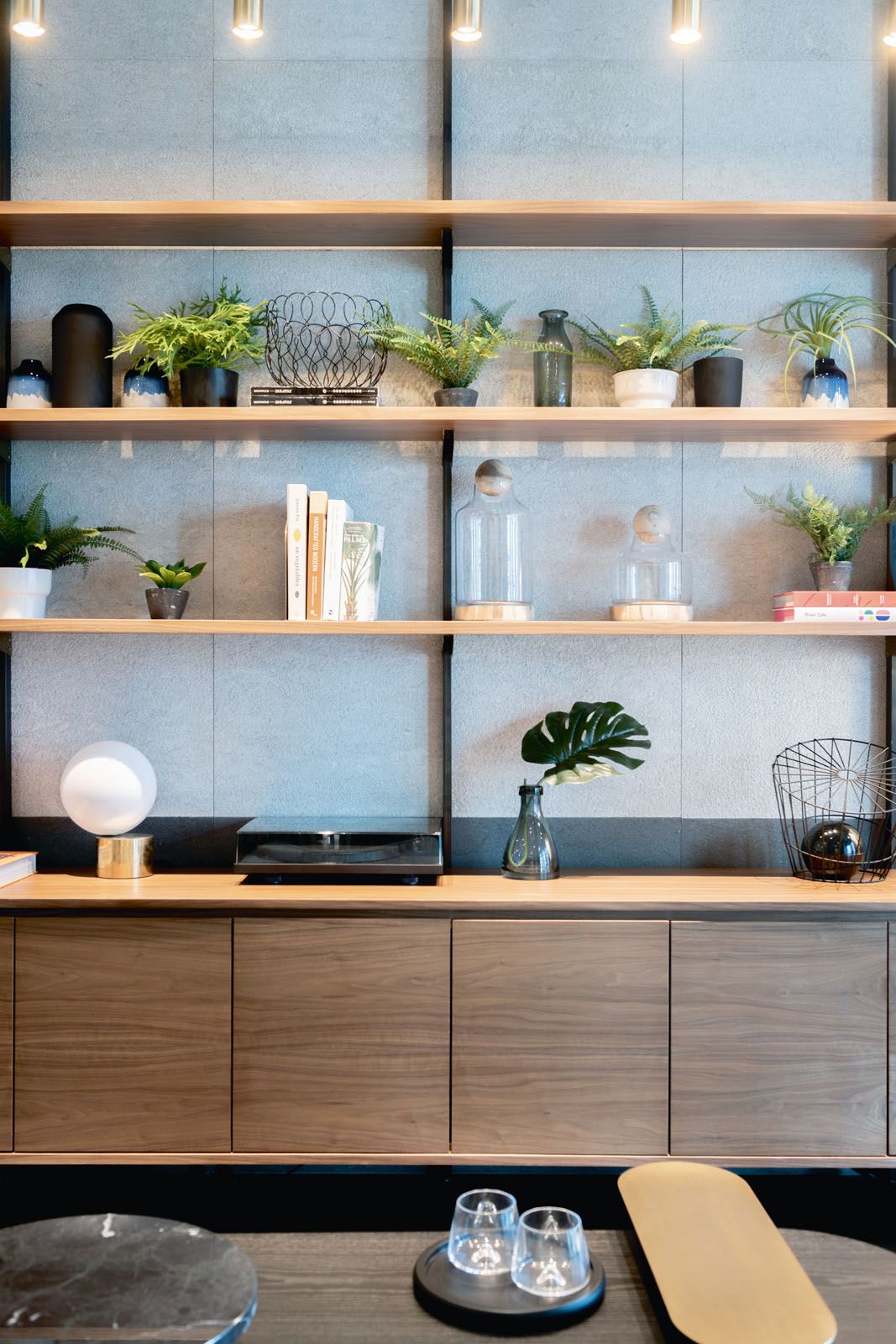 Designed by Takenouchi Webb, potted plants liven up the living room of a showflat in Marina One