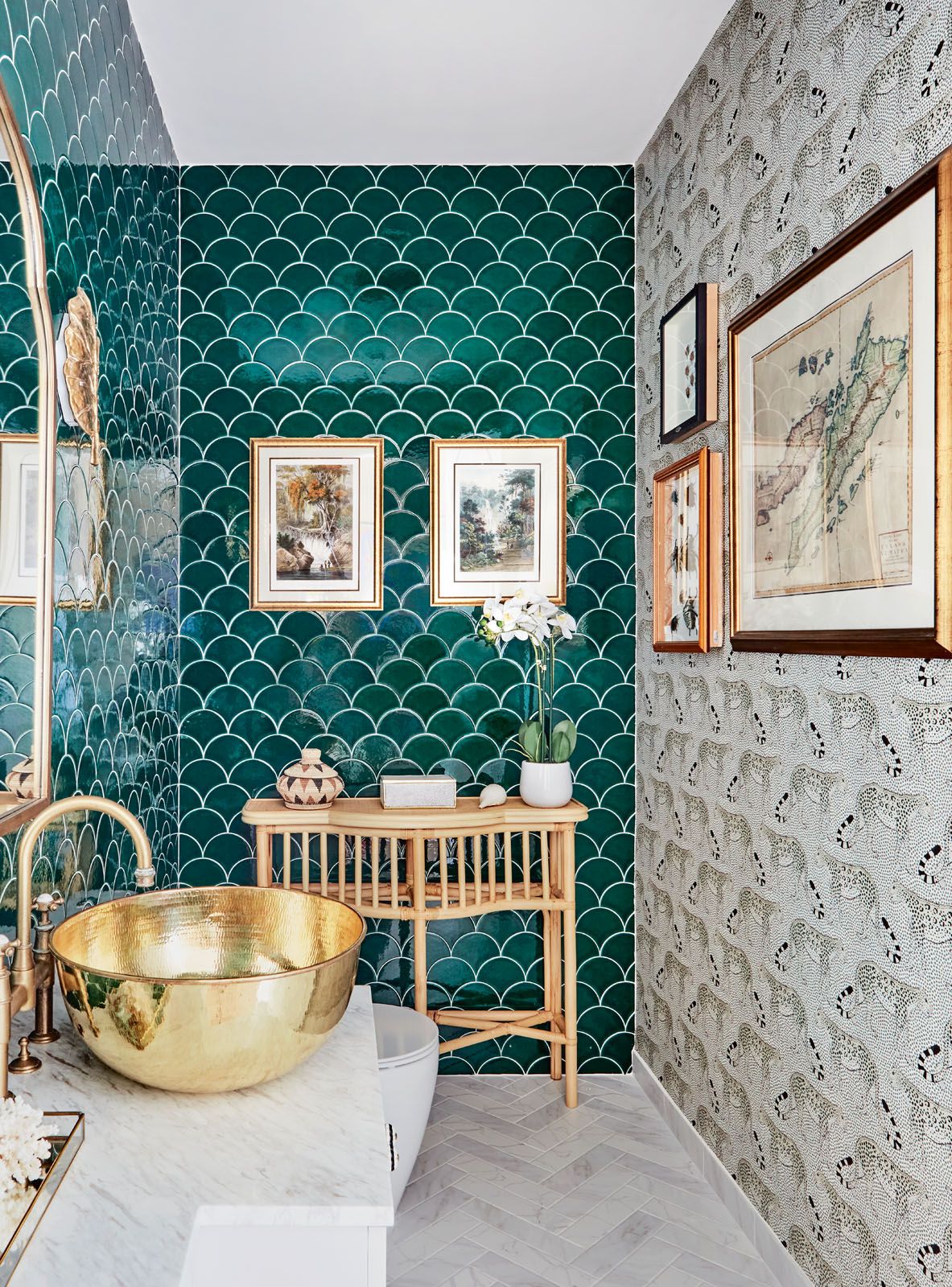 The scalloped wall tiles and the Cole & Son Leopard wallpaper add a playful touch to this bathroom designed by E&A Interiors
