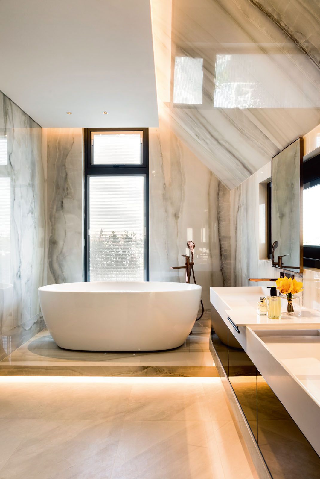Onyx-effect tiles were selected for easy maintenance of the master bathroom