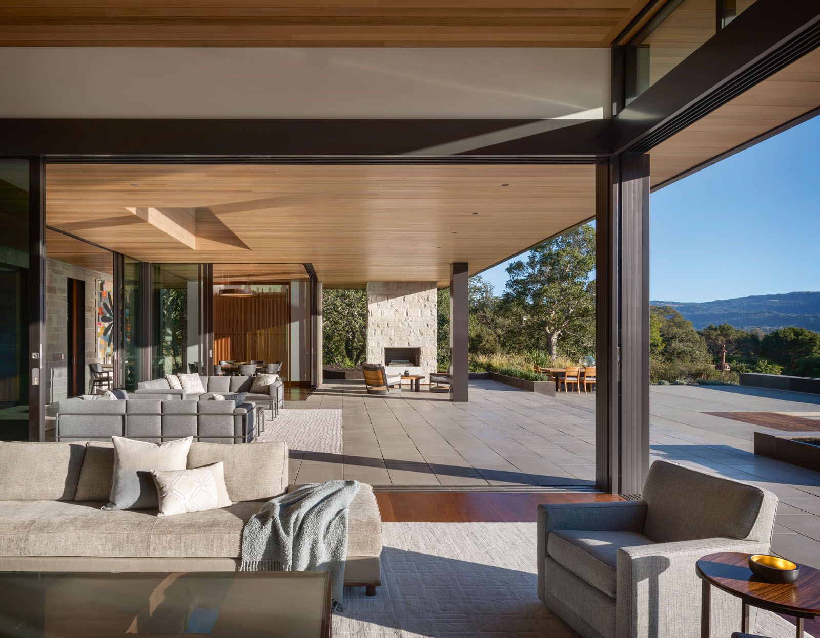 Sliding doors open up to beautiful views of Portola Valley and the mountains beyond, emphasising the home’s connection to nature