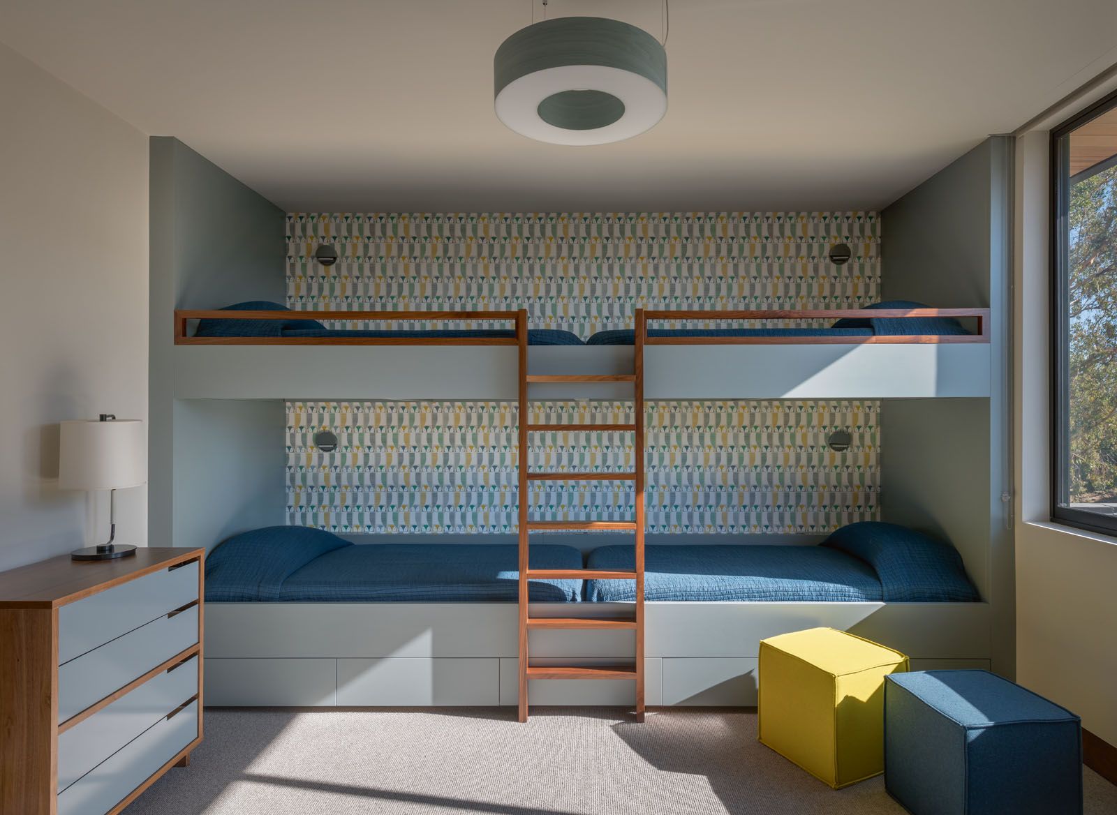 The guest room features double-decker beds for four
