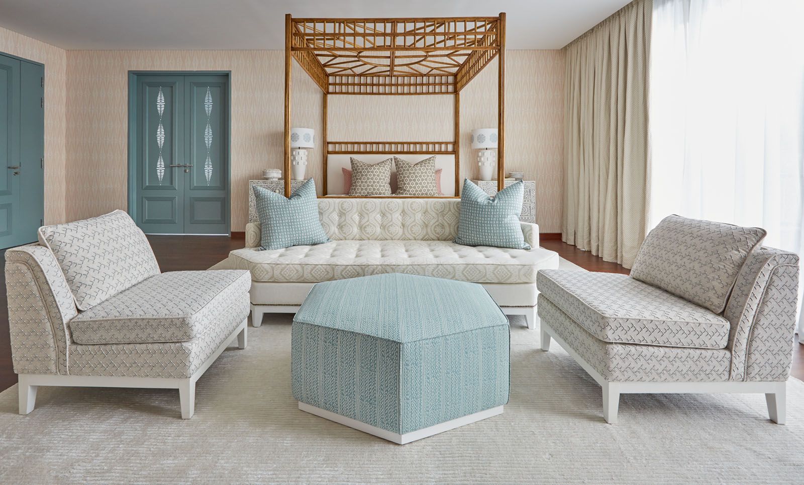 The master bedroom features an elegant mix of colours and fabrics in coral and blue