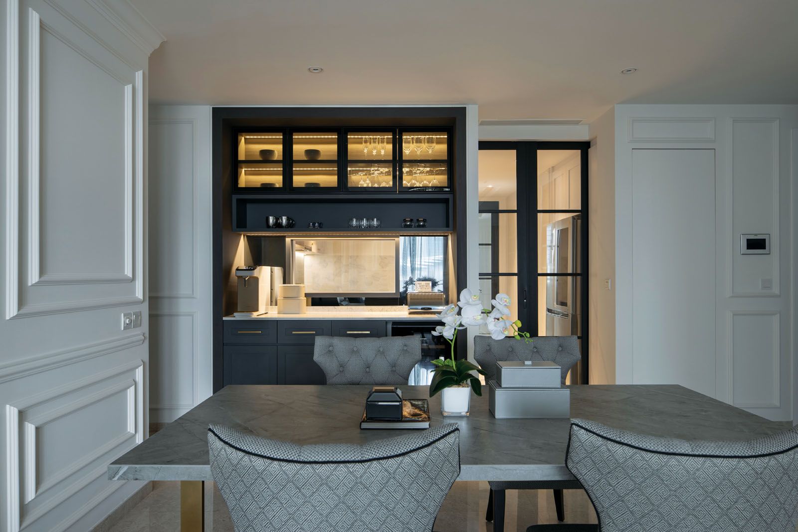 A view of the kitchen and dining area from the living room;