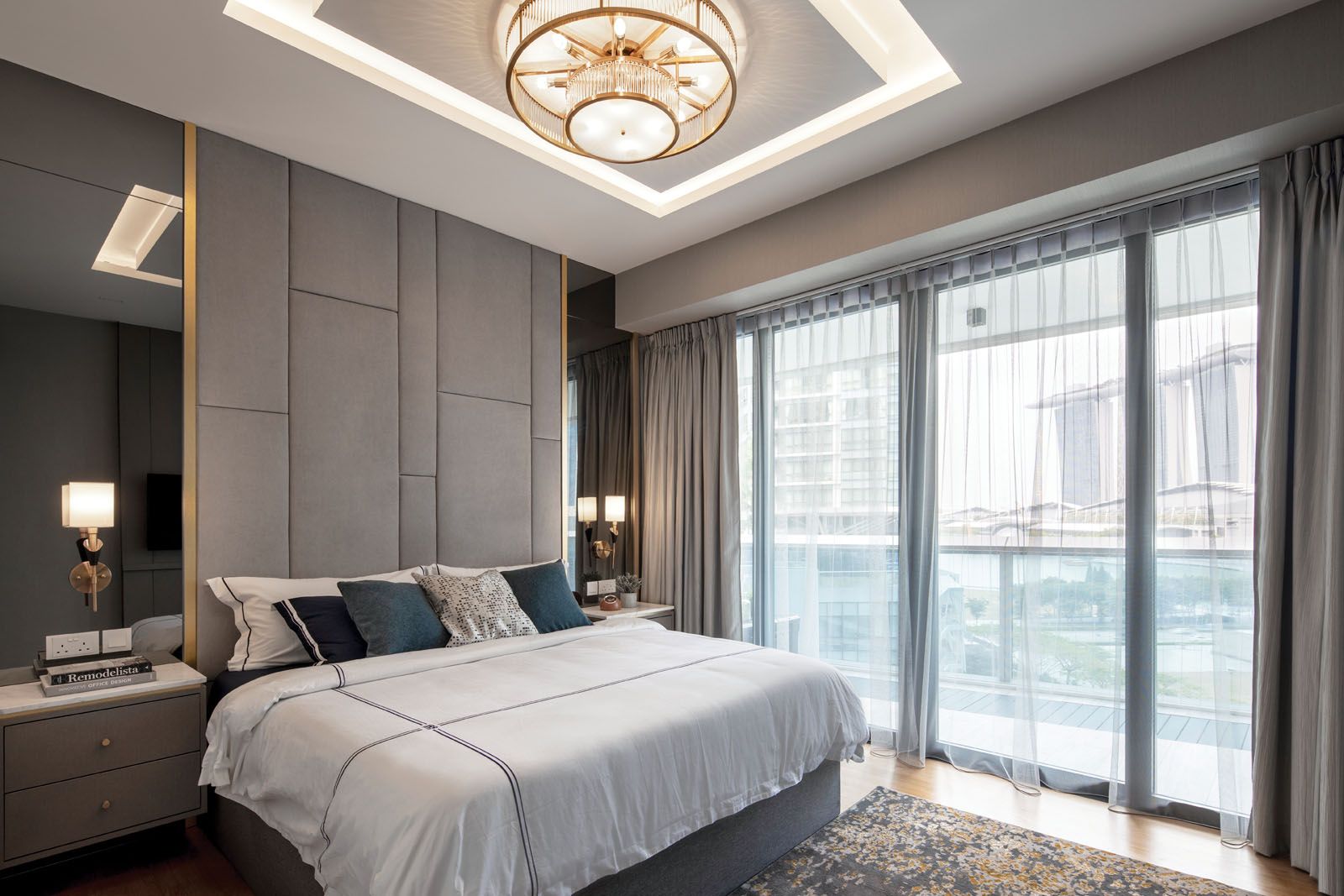 Gold trimmings and the leather headboard elevate the look of the master bedroom