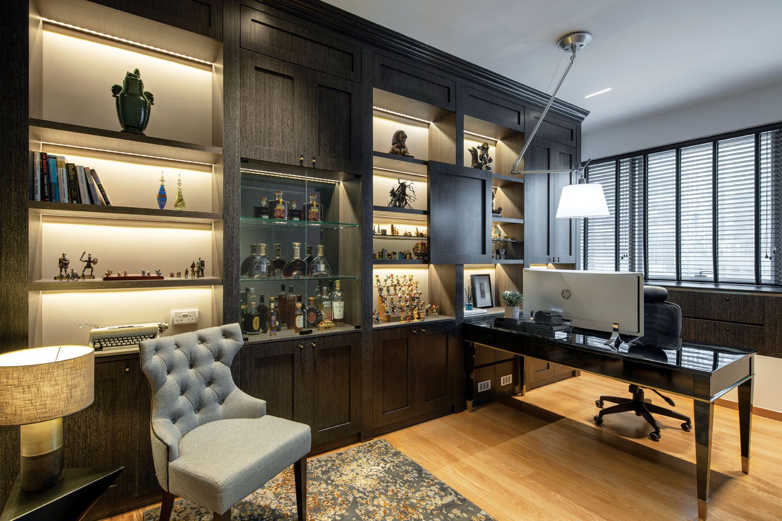 The study houses the husband’s collection of spirits and figurines