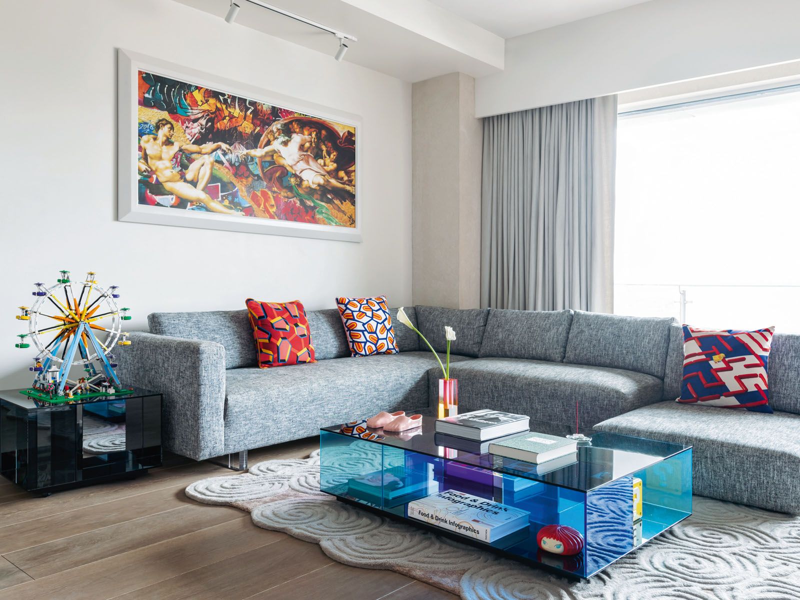 The family’s collection of pop art and decorative pieces add a playful touch to this living room