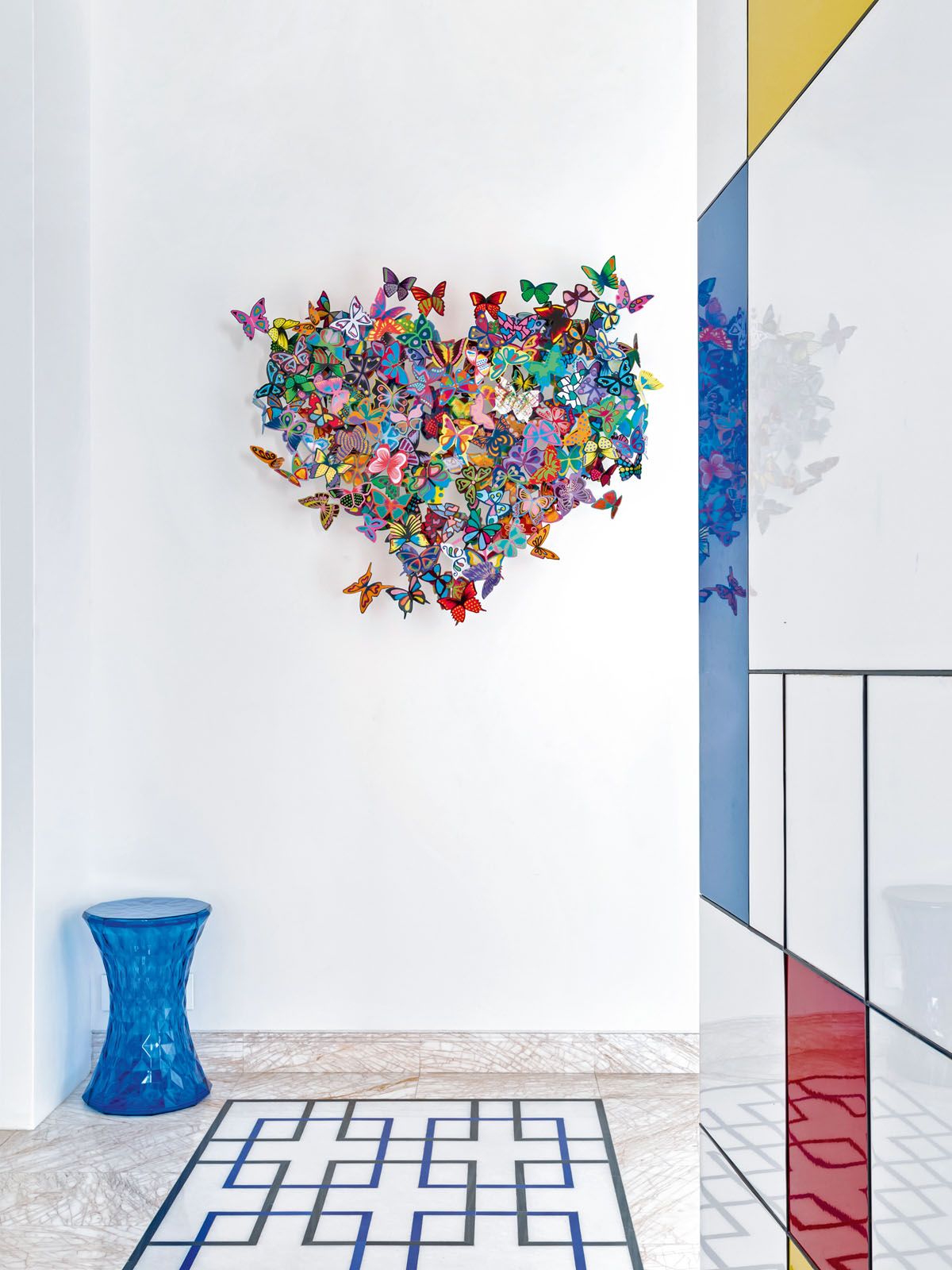 Other artistic elements include a butterfly-themed installation by David Kracov placed next to a feature wall that takes cues from the work of Dutch painter Piet Mondrian
