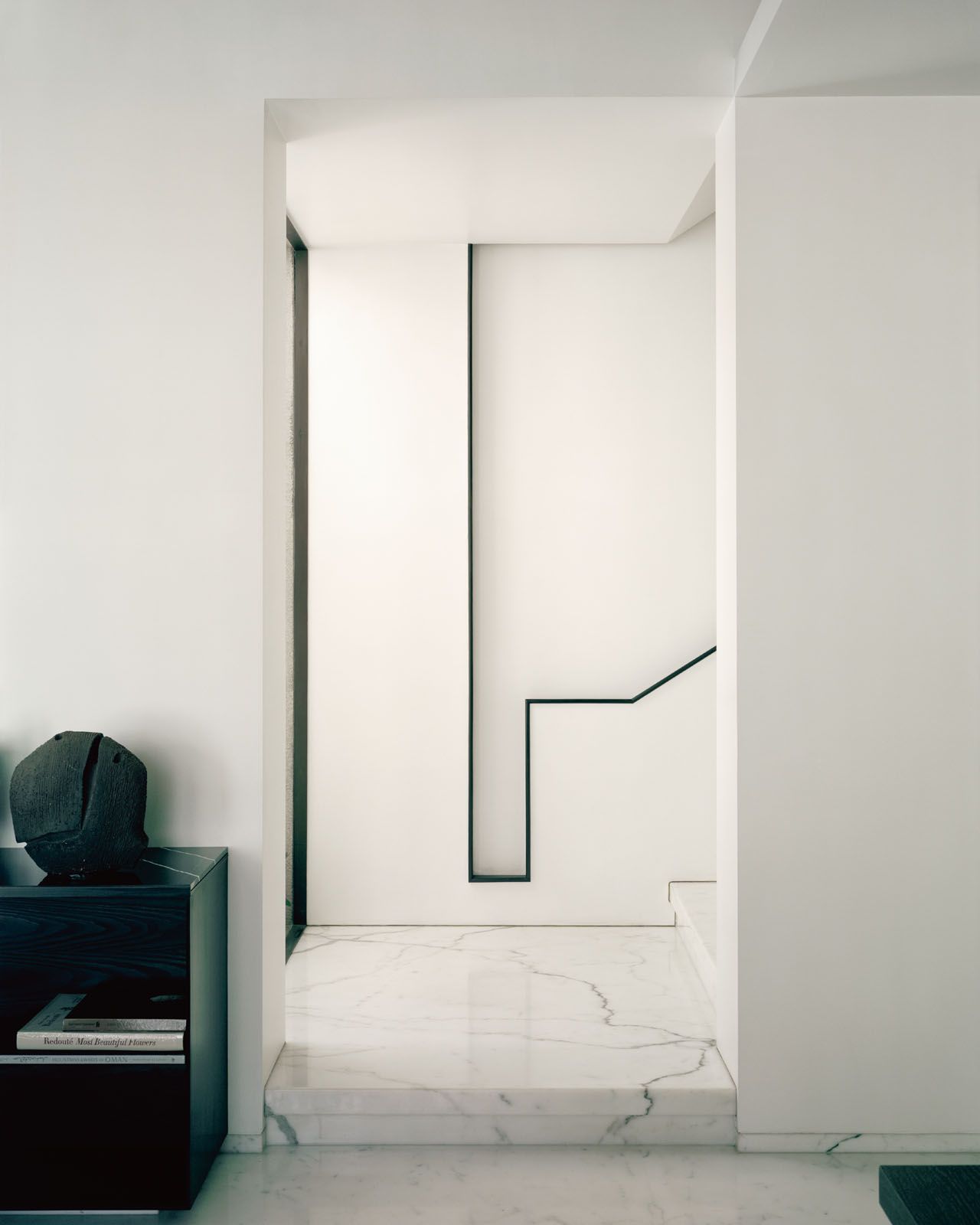 The handrail on the staircase that leads to the son’s apartment is an homage to Italian architect Carlo Scarpa