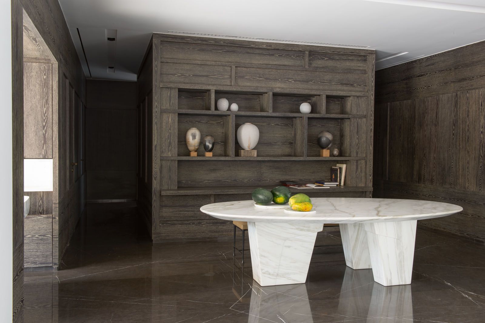 The generous use of dark wood creates a stylish cocoon