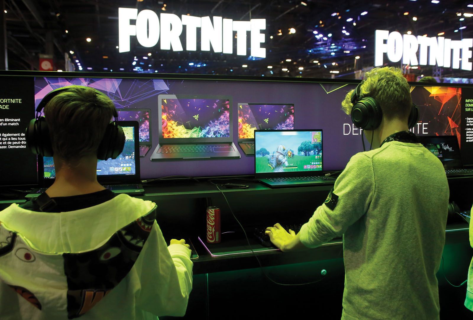 Razer has been the gaming brand of choice among gamers the world over for several years, as seen by these youths playing the Fortnite game on a Razer laptop during the 2018 video game trade fair, Paris Games Week (image by Chesnot/Getty Images)