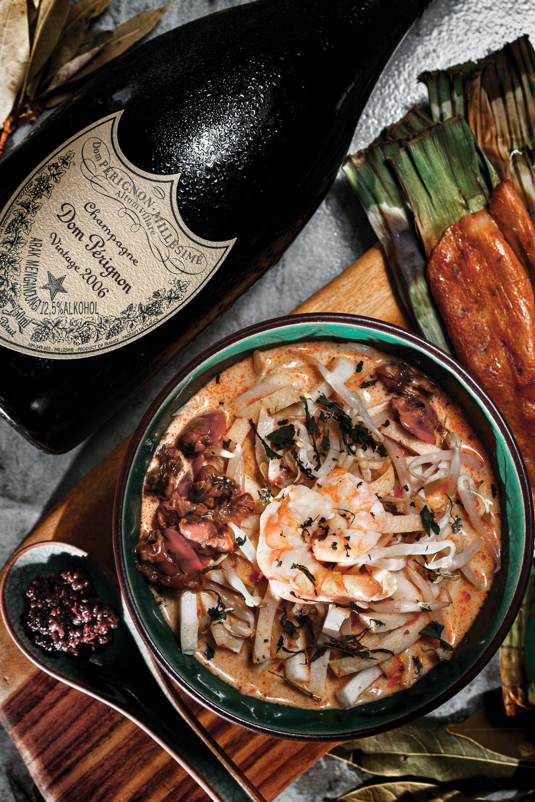The bright acidity and creamy mouthfeel of champagne not only cuts through fatty flavours but also complements rich and creamy broths such as laksa