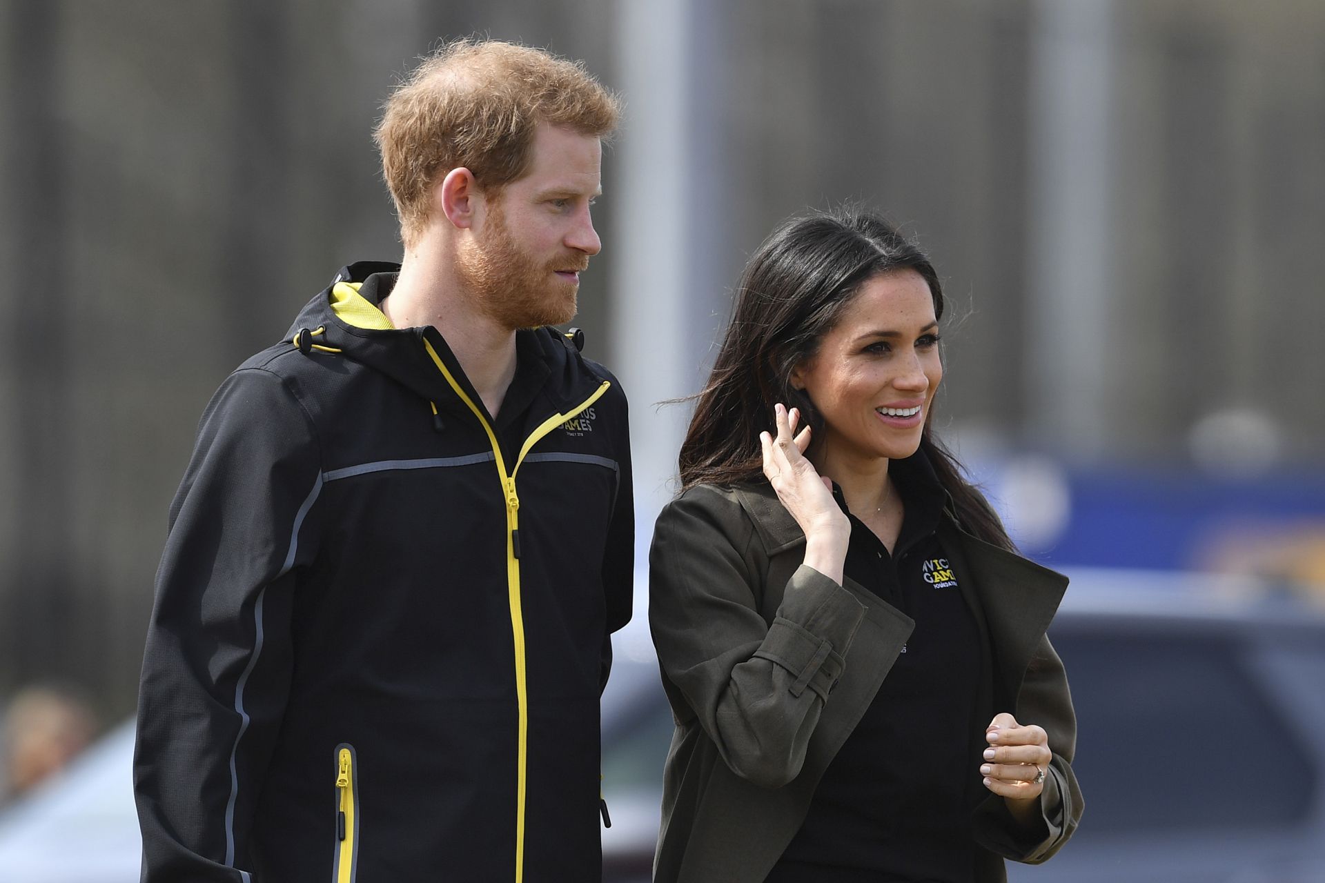 Britain's Prince Harry (L) and his fiancee US actress Meghan Markle (R) arrive to meet participants at the UK team trials for the Invictus Games Sydney 2018 at the University of Bath Sports Training Village in Bath, southwest England on April 6, 2018.The Invictus Games is an international sport event for wounded, injured and sick (WIS) servicemen and women, both serving and veteran. The Games aims to use the power of sport to inspire recovery, support rehabilitation and generate a wider understanding of al