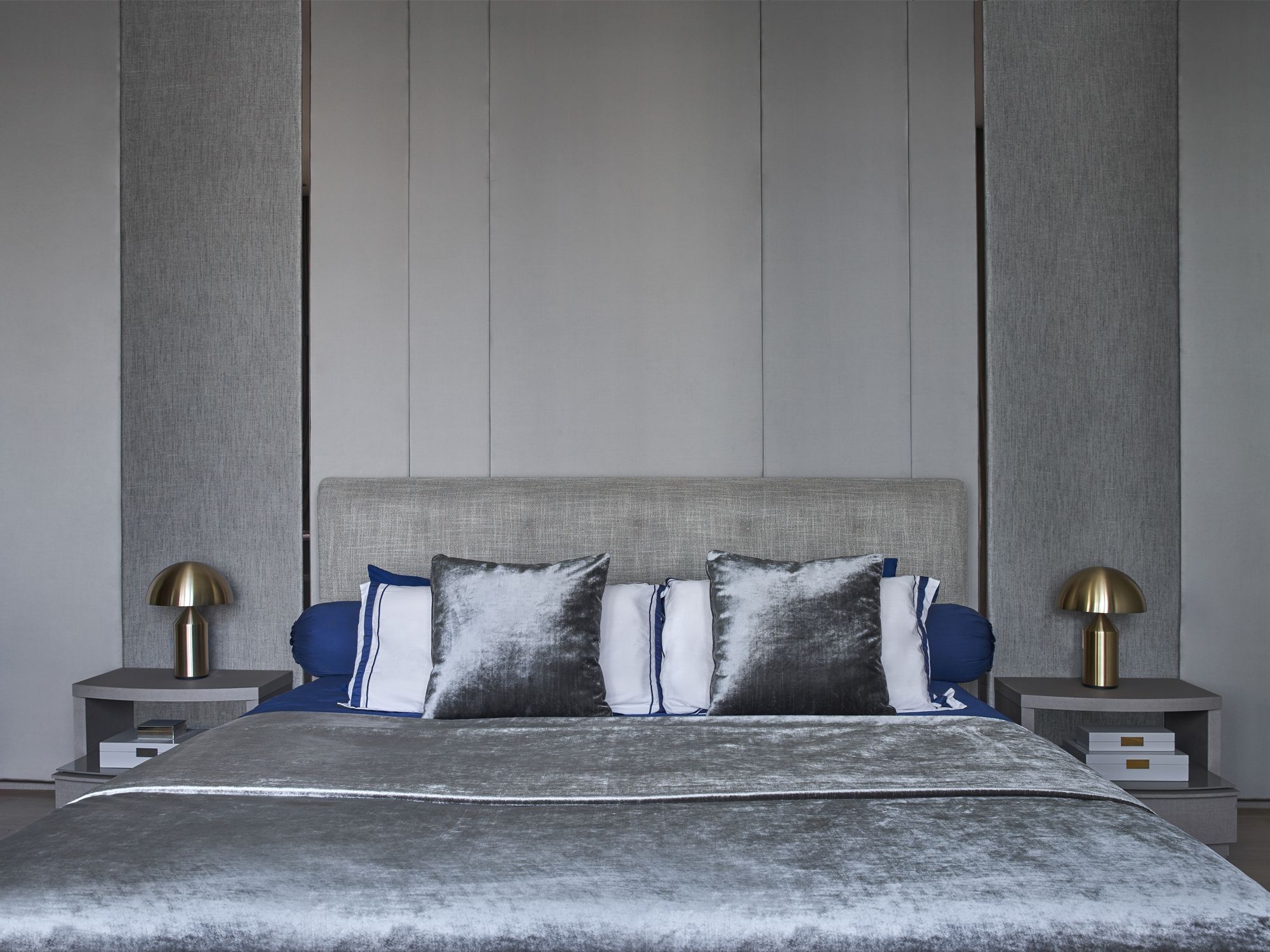 The bedroom features a Minotti bed that takes centre stage
