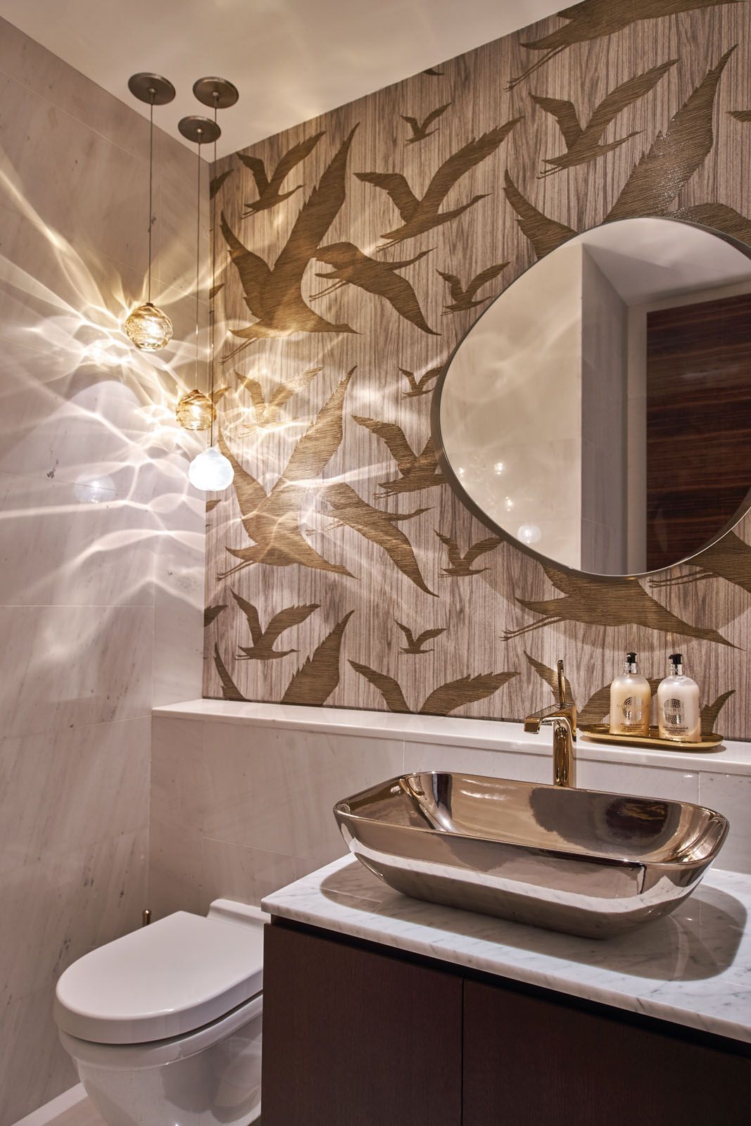 This bathroom interior designed by Topic Studio features Siemon & Salazar pendant lights