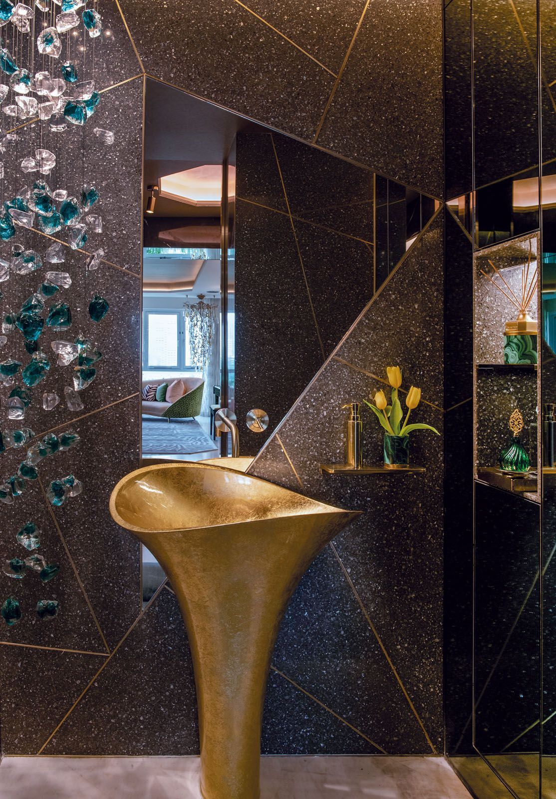 Design Intervention crafted this bathroom accent wall with Minera Cambria quartz pieces and gold trimmings