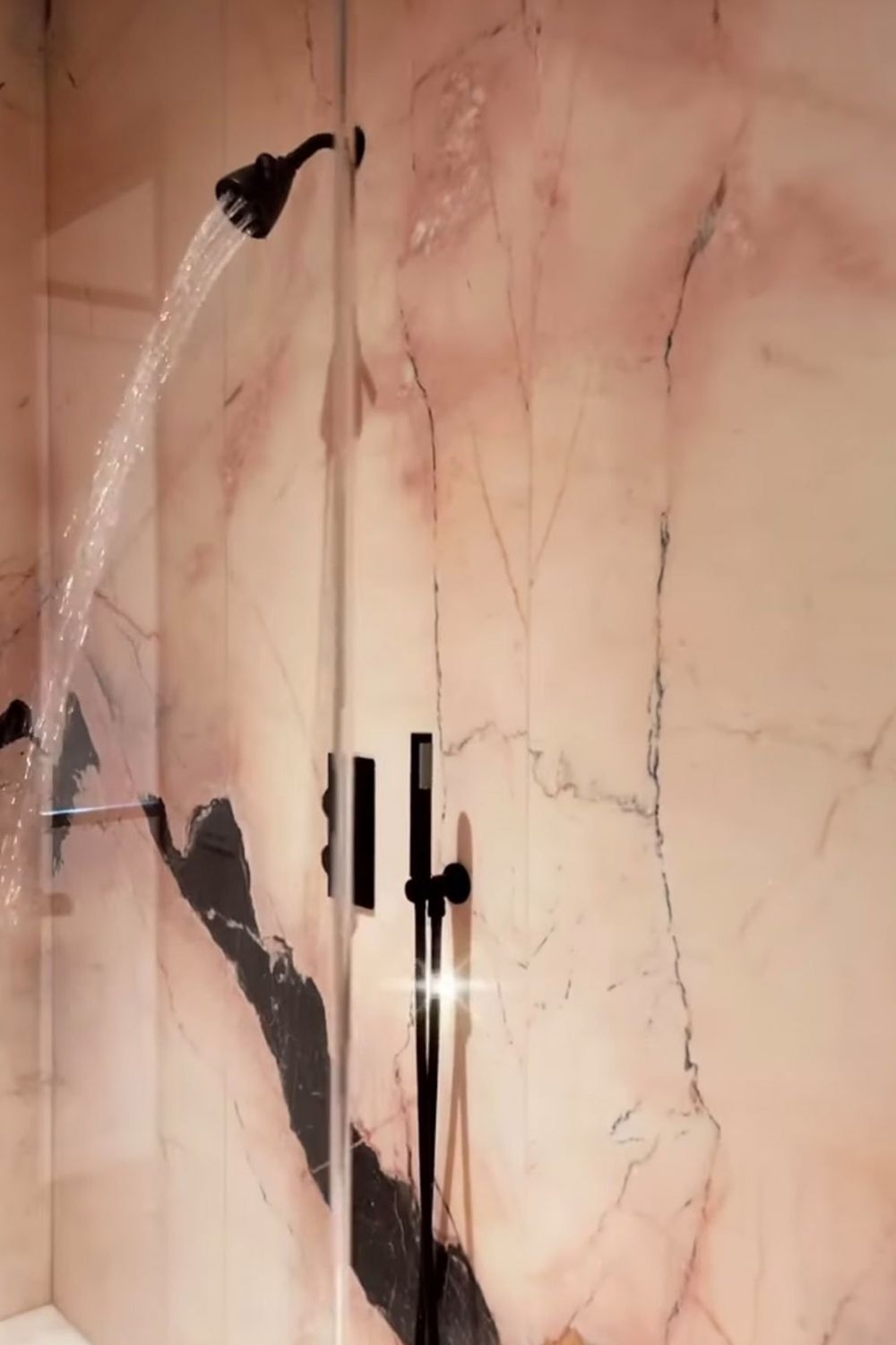 The showerhead and low water pressure in Jenner's walk-in office shower sent the Internet into a flurry (Image: Kylie Jenner)
