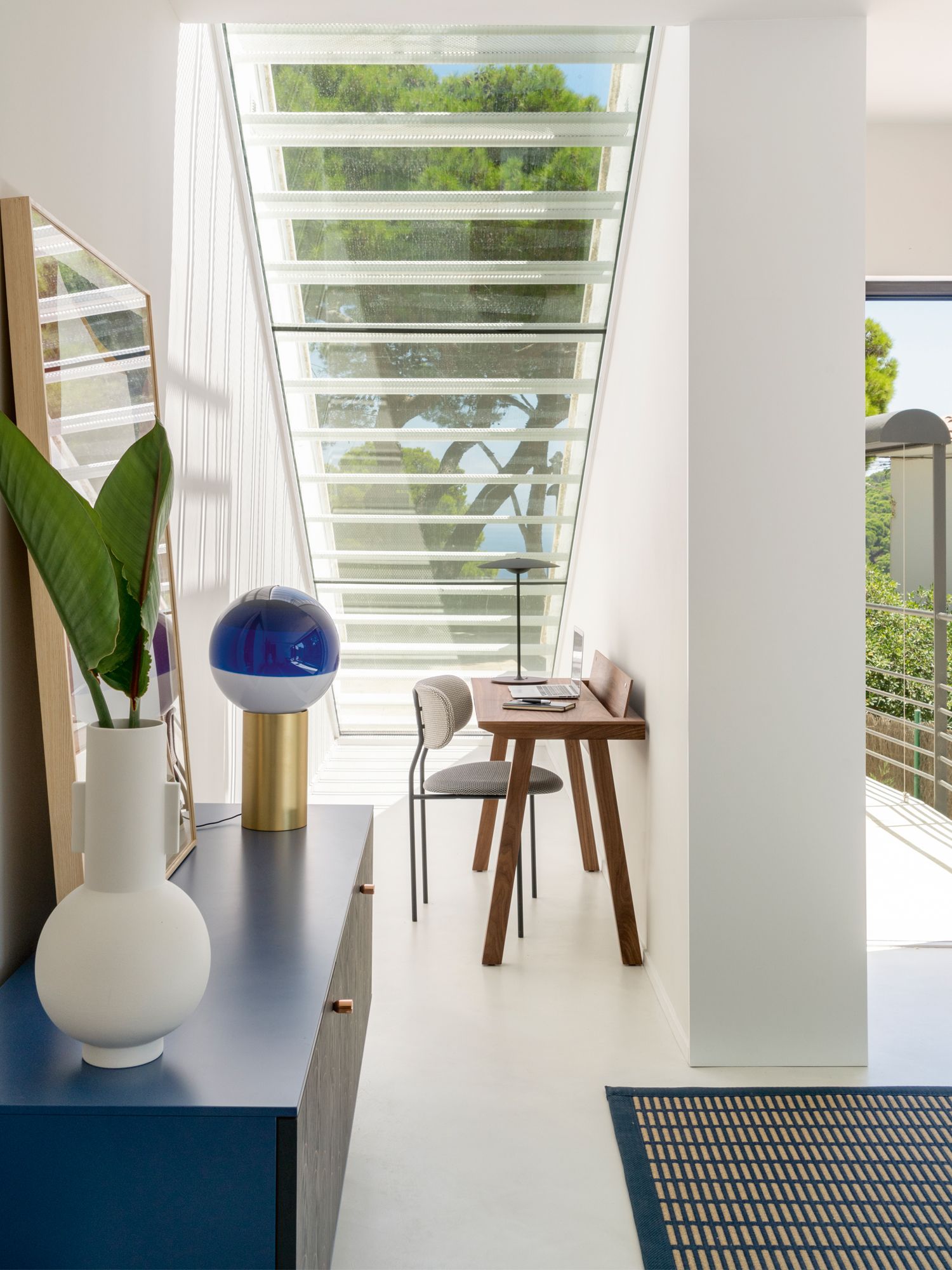 This nook in the foyer features a Punt Mobles desk, Gubi chair and Marset lamps