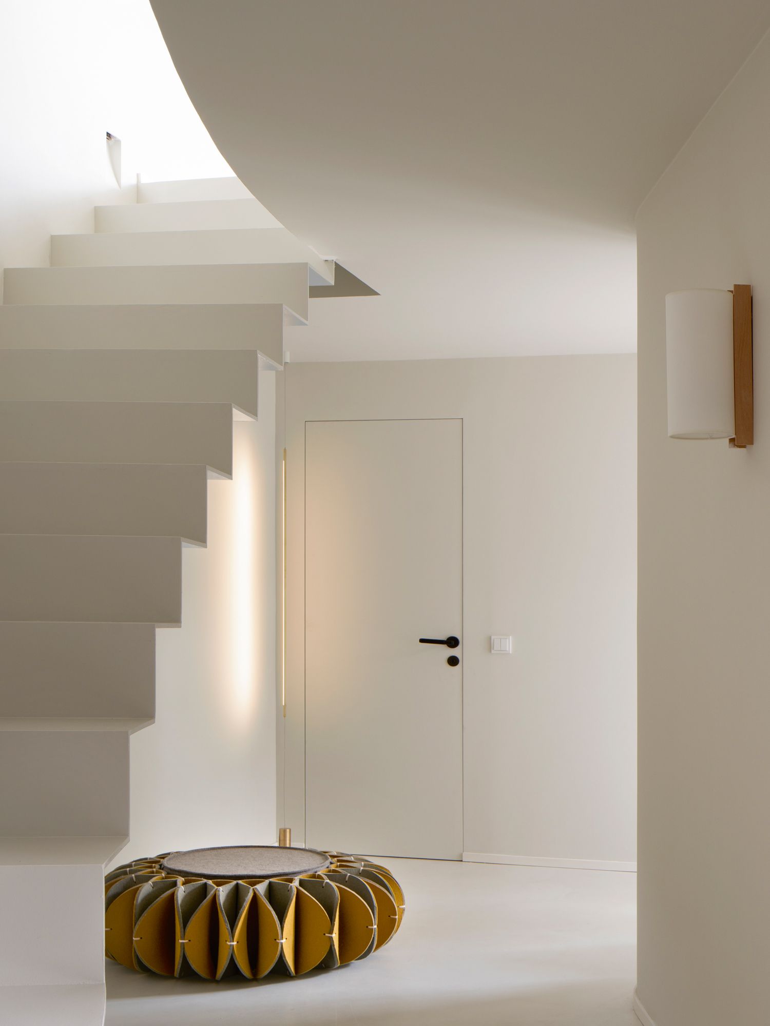 A playful pouf from Gan by the stairs