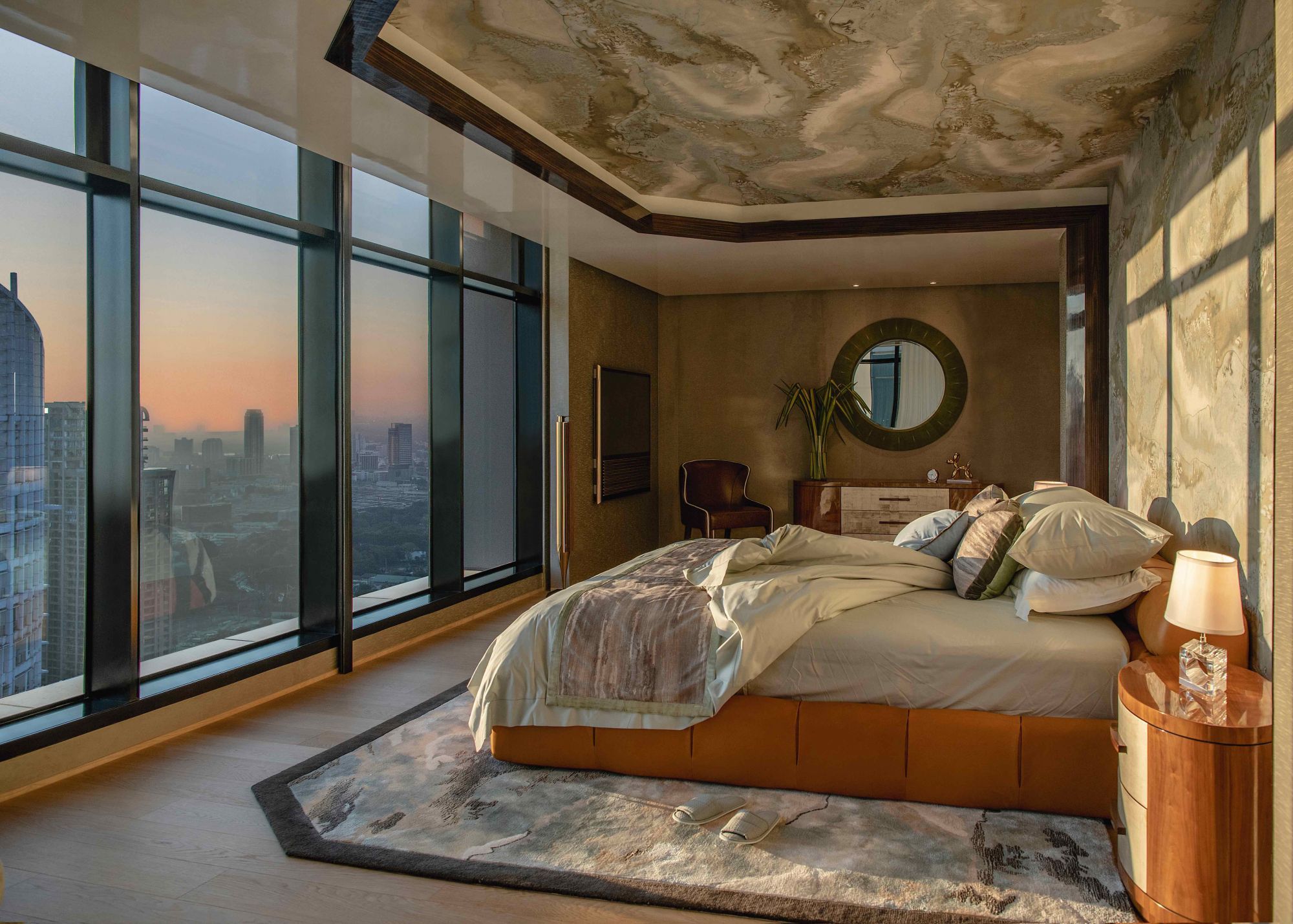 The master suite of the apartment features a handsome interior with walnut finishing touches