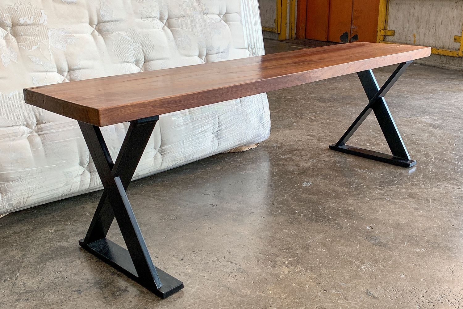 Teak bench with ‘X’ legs, from Hock Siong & co. (Image: Hock Siong & Co.)