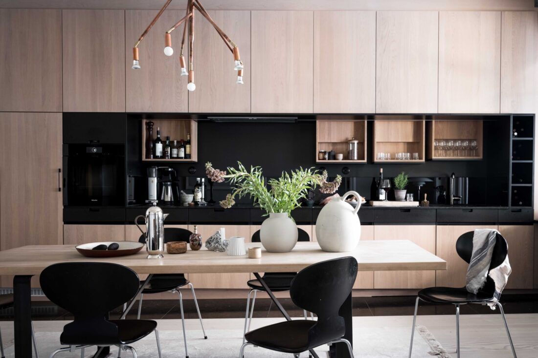 Styled by Emma Hos for a house in Sweden, this contemporary kitchen features four compact shelves (Image: Alen Cordic)