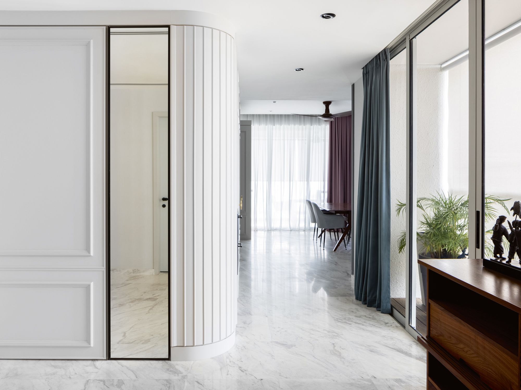 The light colour palette elevates the lofty feel of the entryway