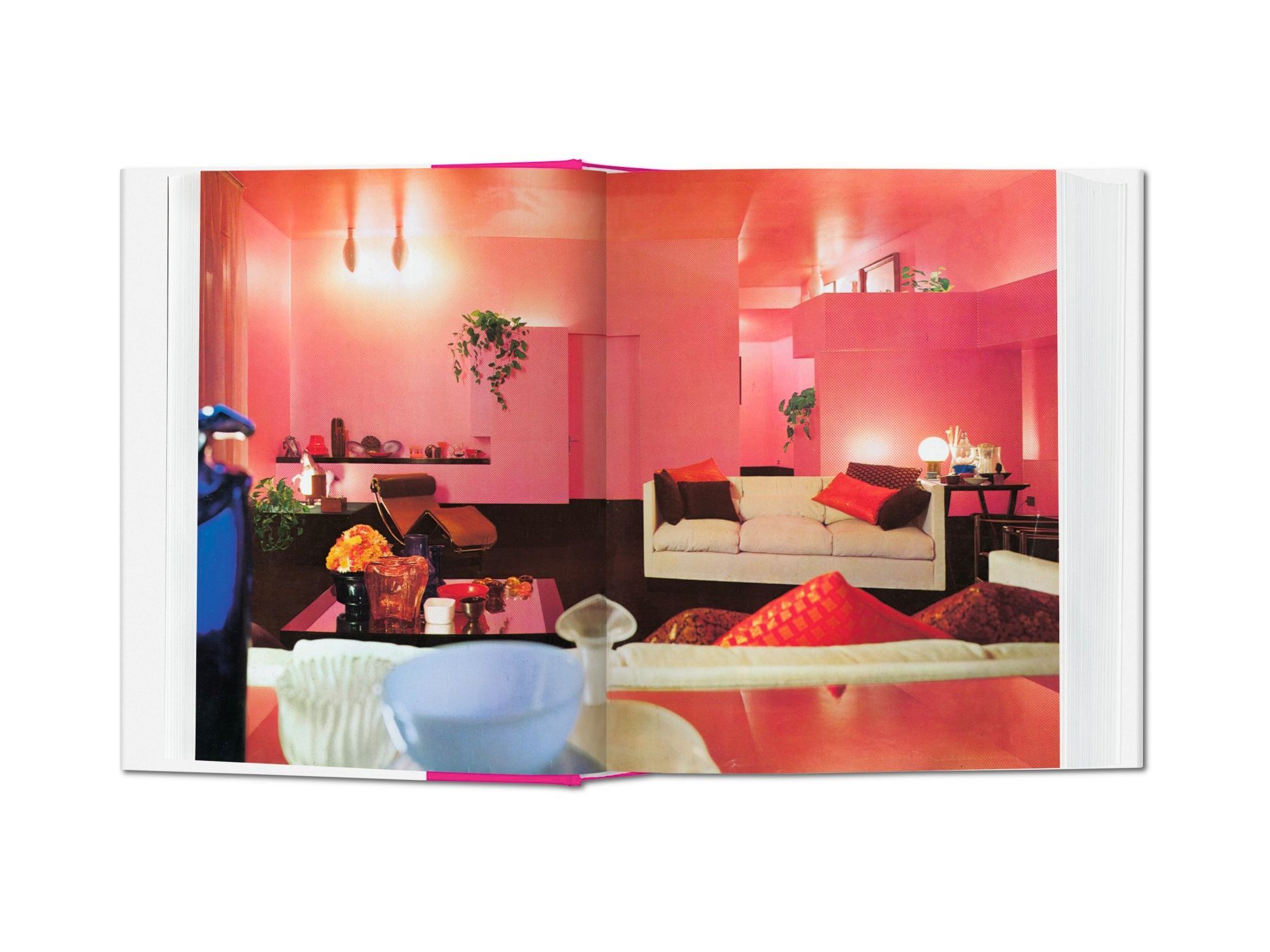 A room decorated in vivid pink showcases the loud and vibrant interior styles in the '60s (Image: Taschen)