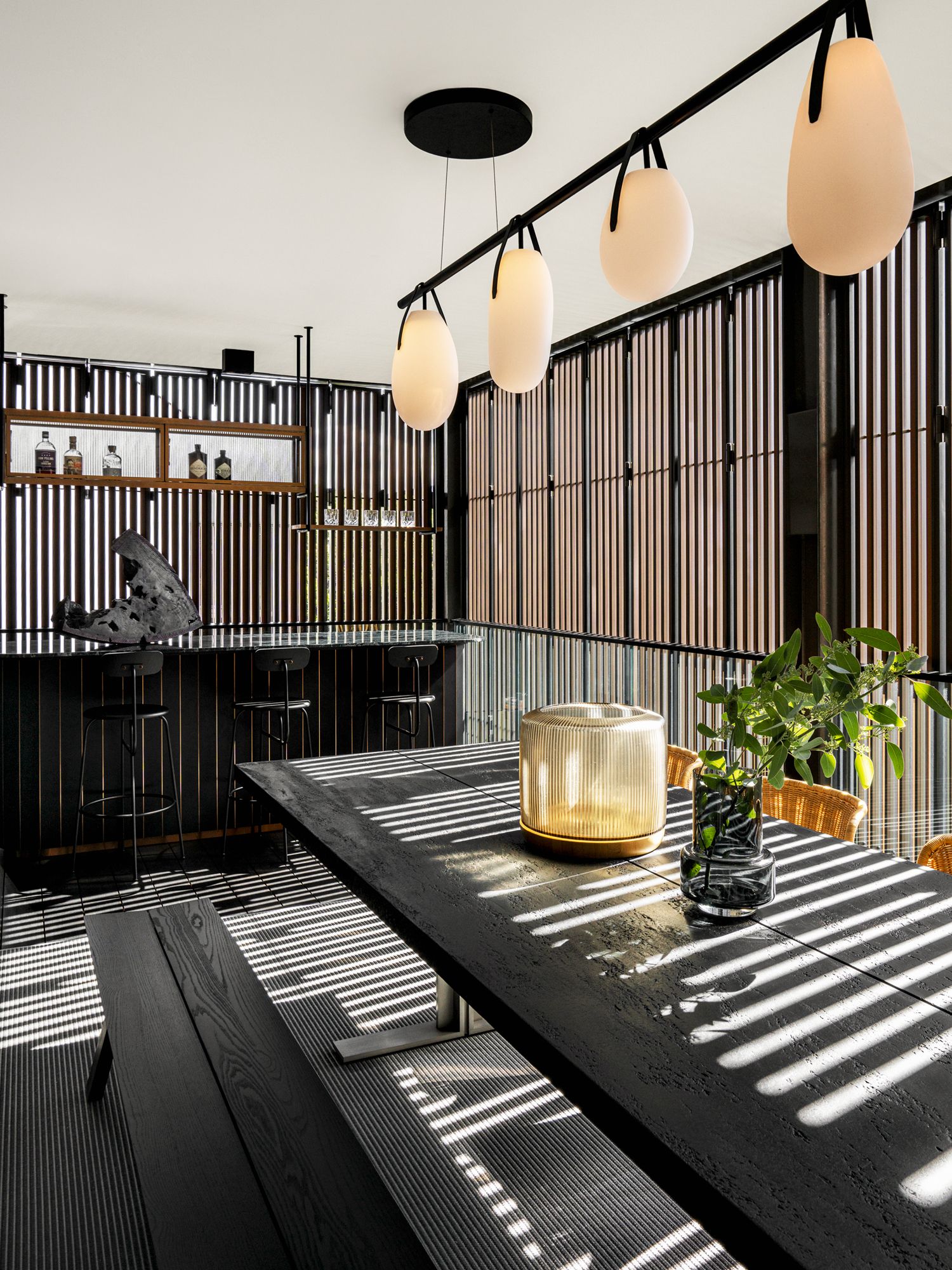 The balcony features a dining table from Lema and pendant lights from Rich Brilliant Willing