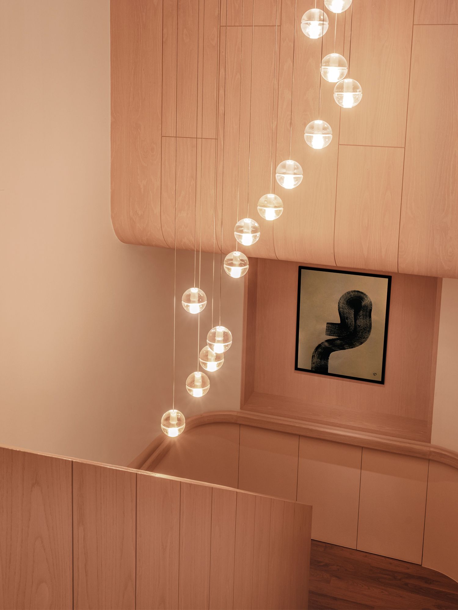 Bocci pendant lights bring a cosy glow to this stairwell
