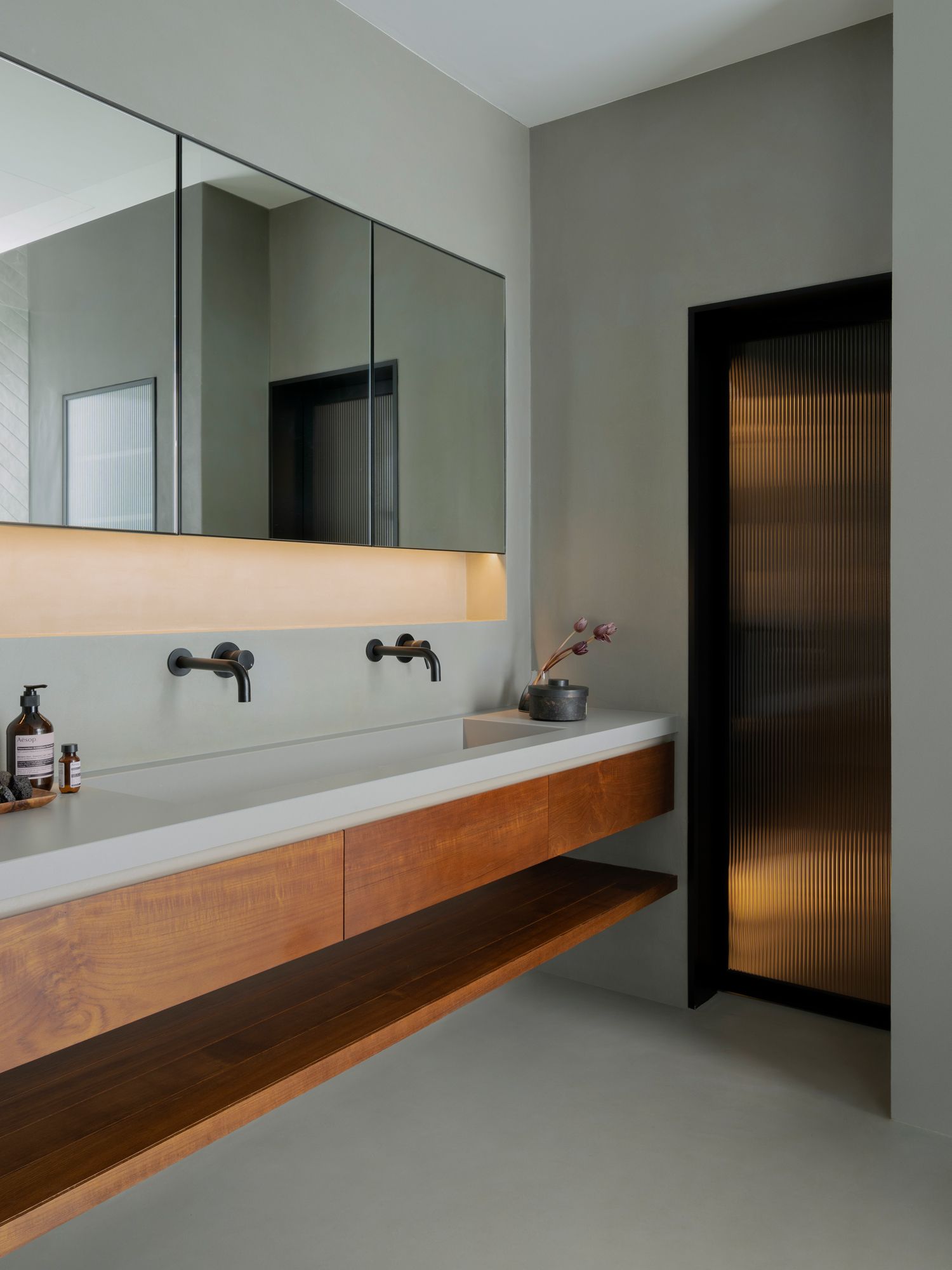 The bathroom features a contemporary and minimal design approach