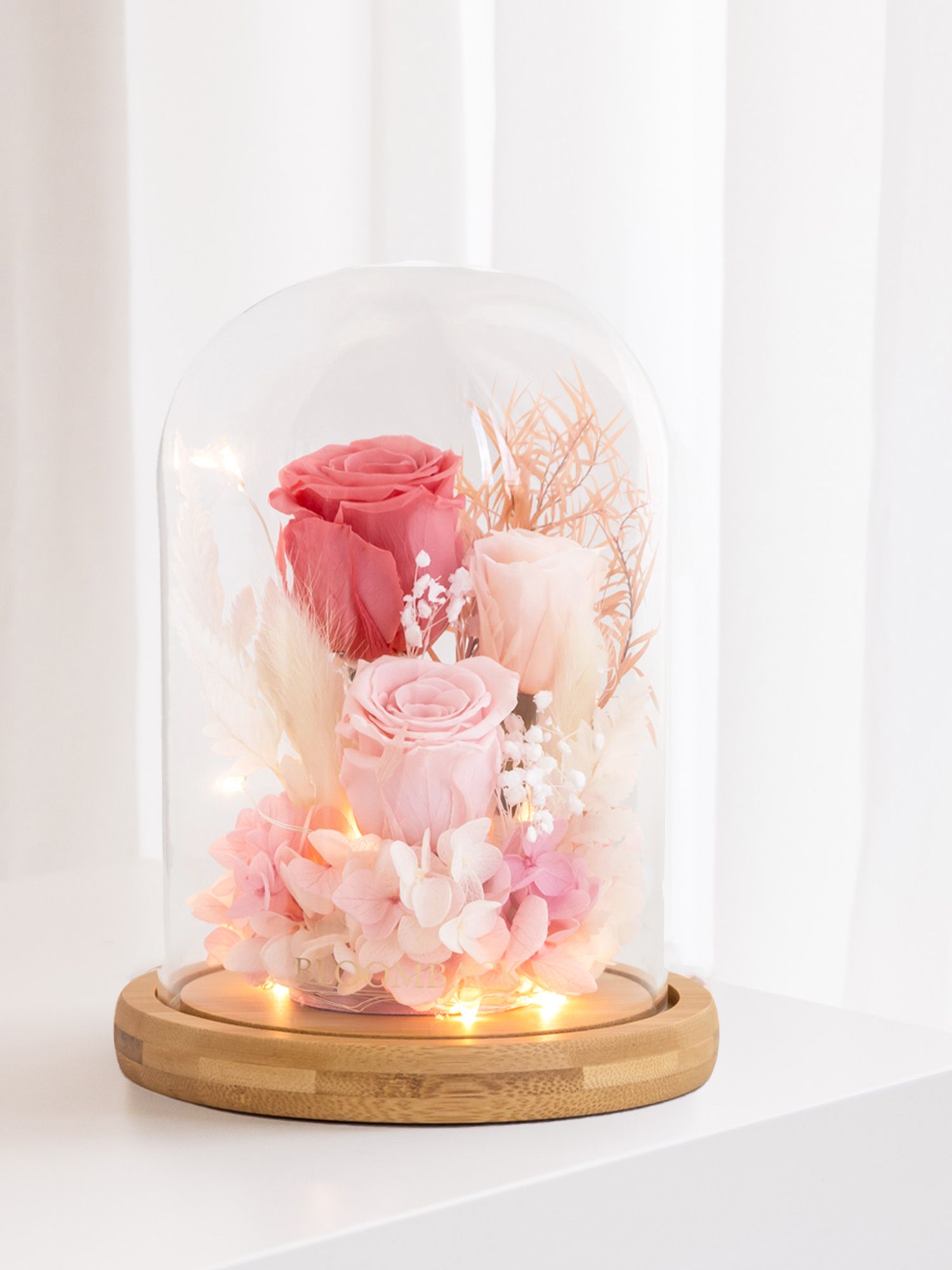 You can also opt to include a LED light and bluetooth speakers inside the glass dome (Image: BloomBack)