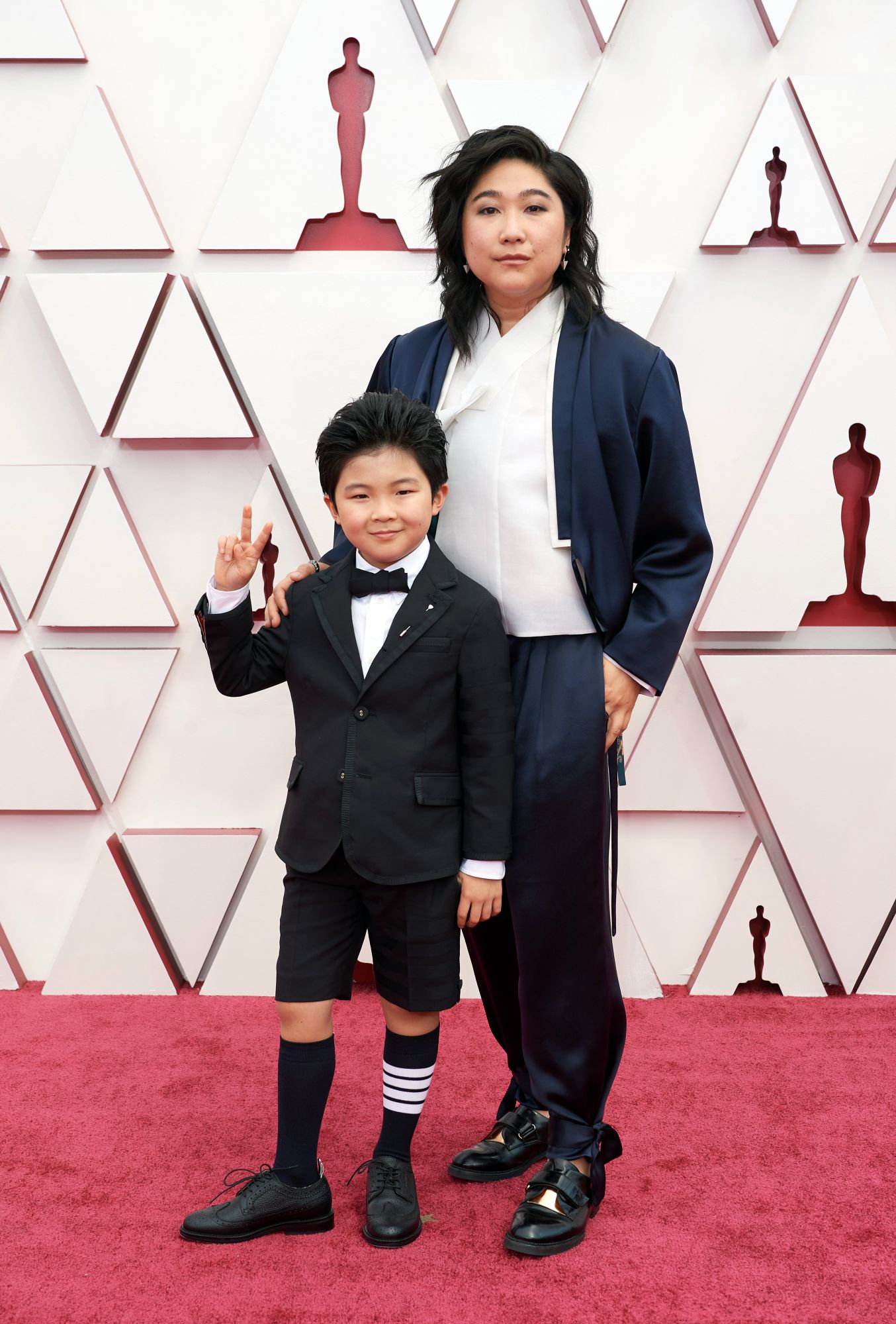 LOS ANGELES, CALIFORNIA â APRIL 25: (EDITORIAL USE ONLY) In this handout photo provided by A.M.P.A.S., (L-R) Alan Kim and Christina Oh attend the 93rd Annual Academy Awards at Union Station on April 25, 2021 in Los Angeles, California. (Photo by Matt Petit/A.M.P.A.S. via Getty Images).