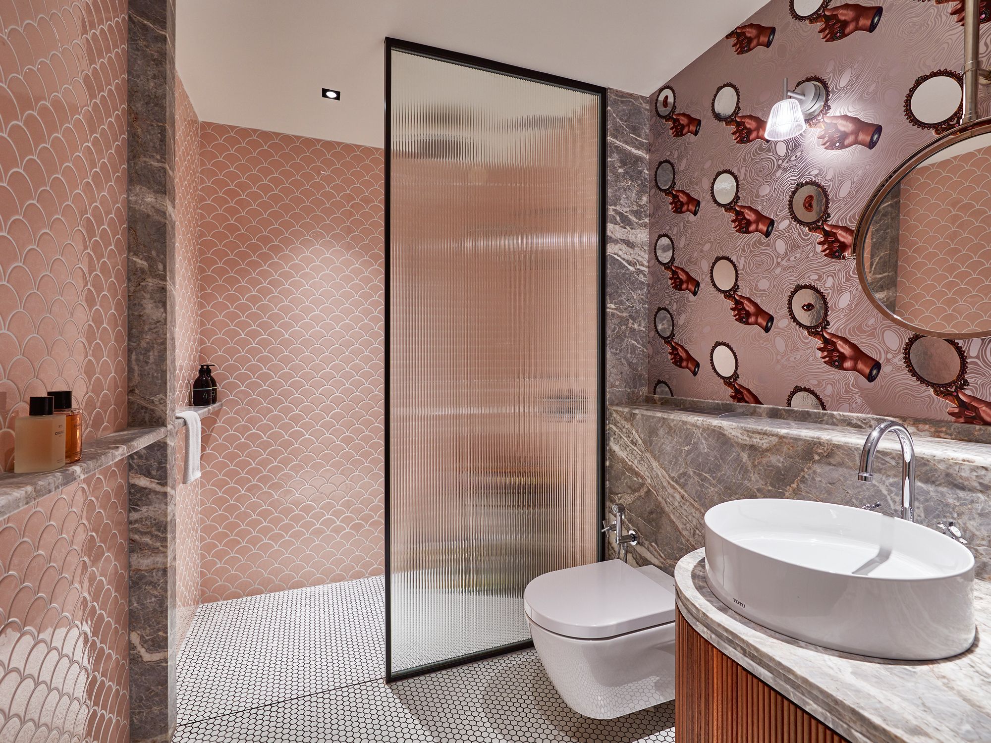 This bathroom by Perinelli Design sports a playful mix of patterns