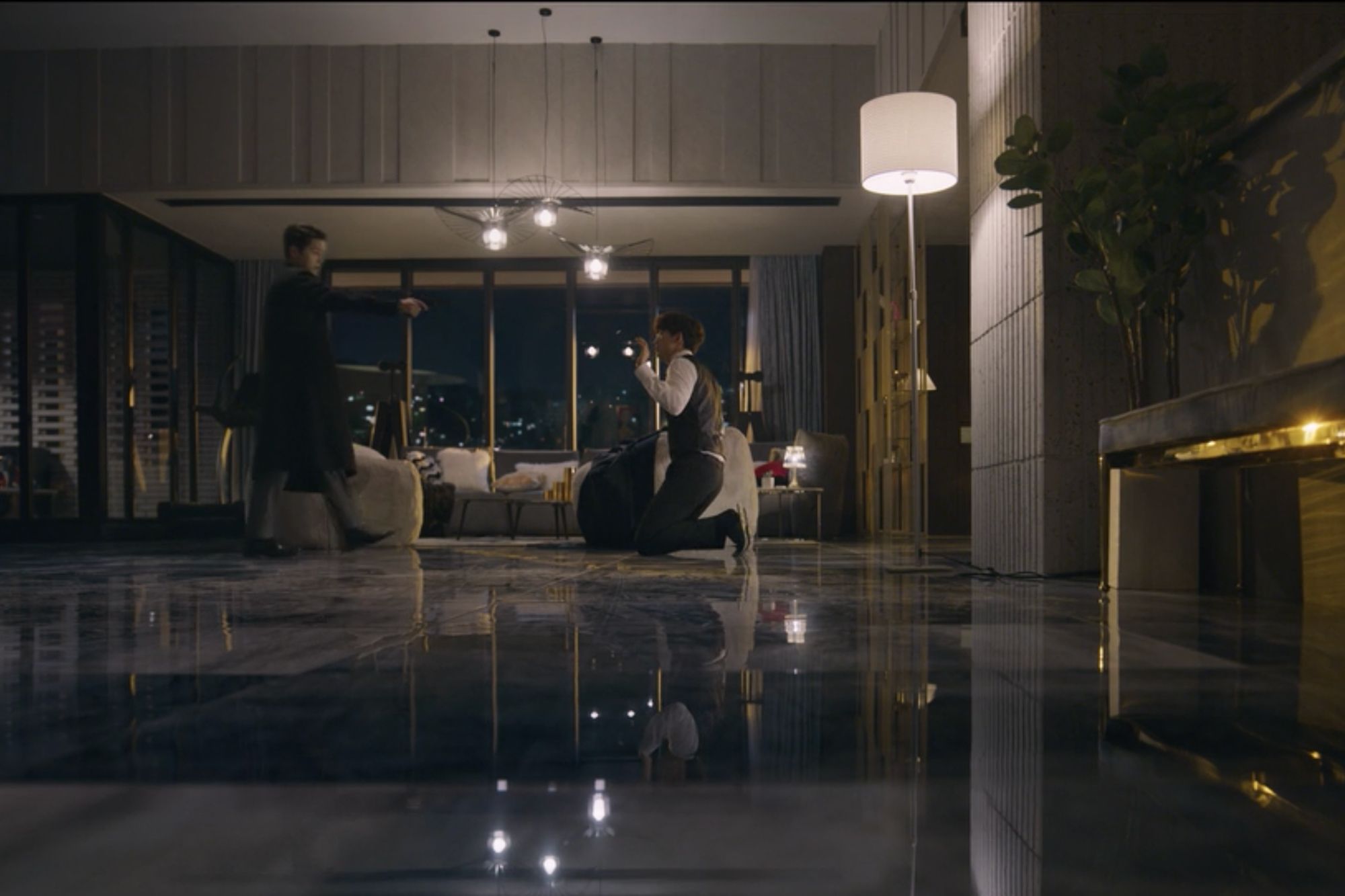 Sleek golden details imbue a rich sense of opulence in this penthouse apartment (Image: Netflix)