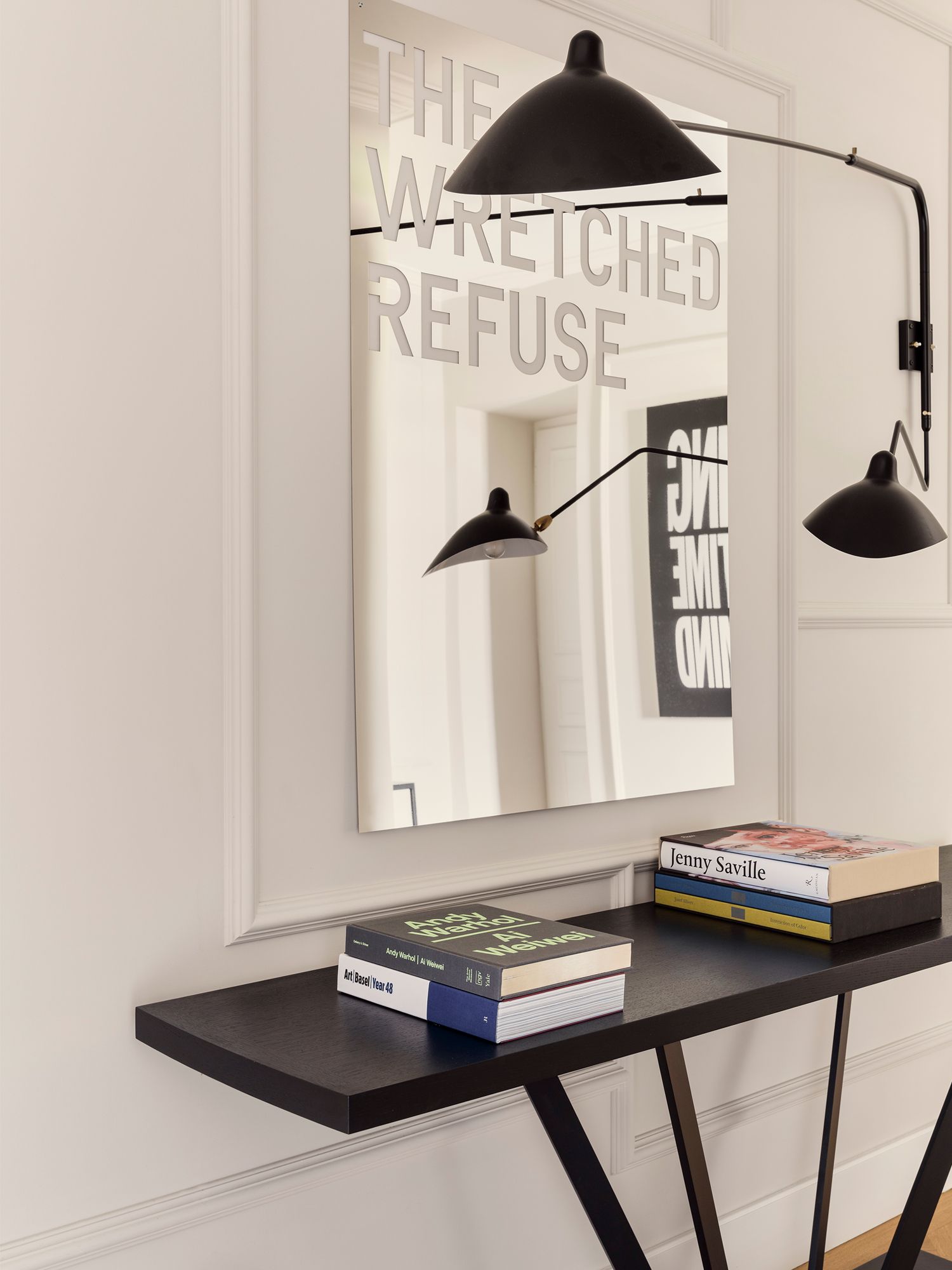 The Rue du Louvre console in the hall is a perfect spot for books