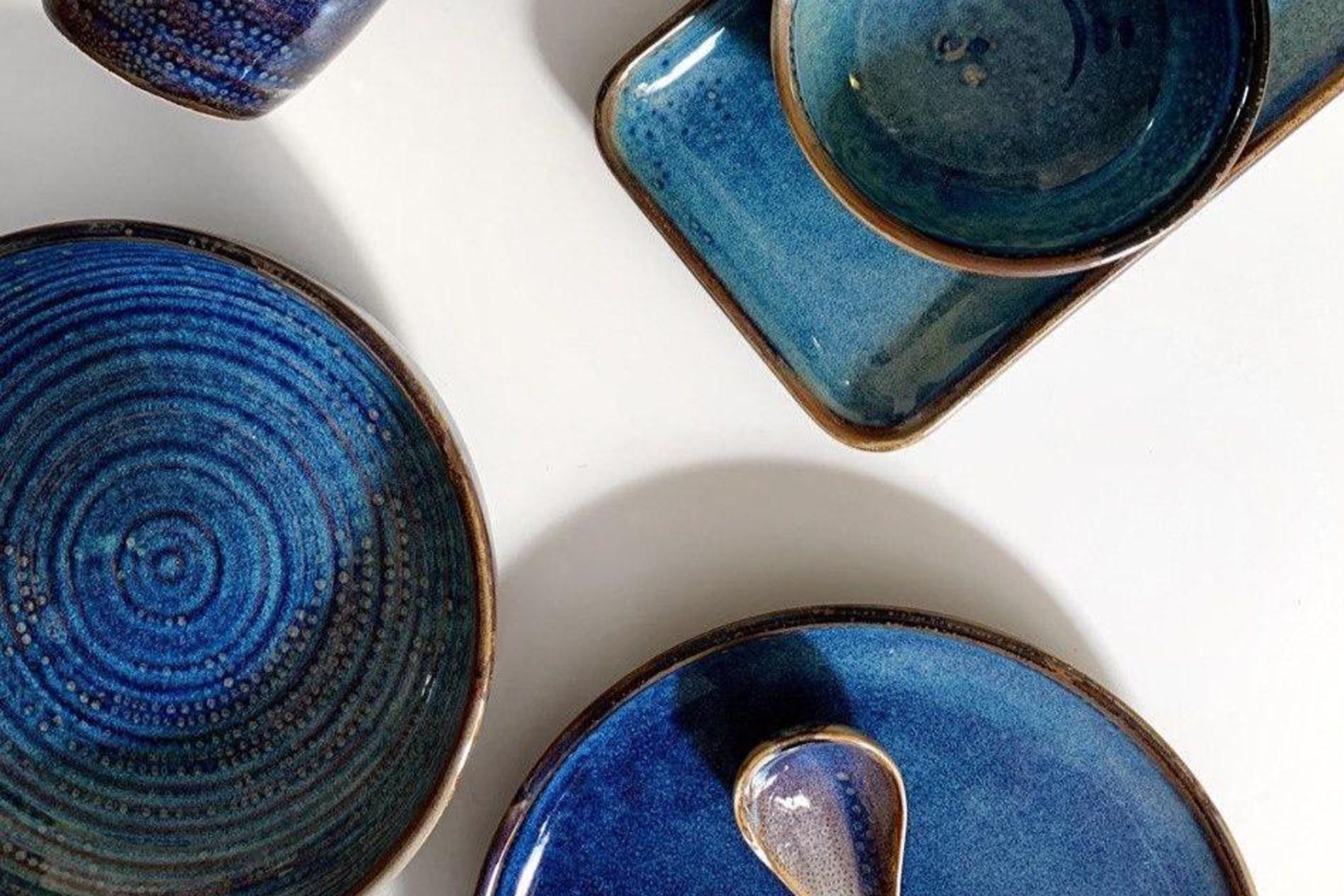 The blue glossy pieces of the Aenon dinnerware collection adds a gorgeous vibrance to dinner settings Photo: Base Piece