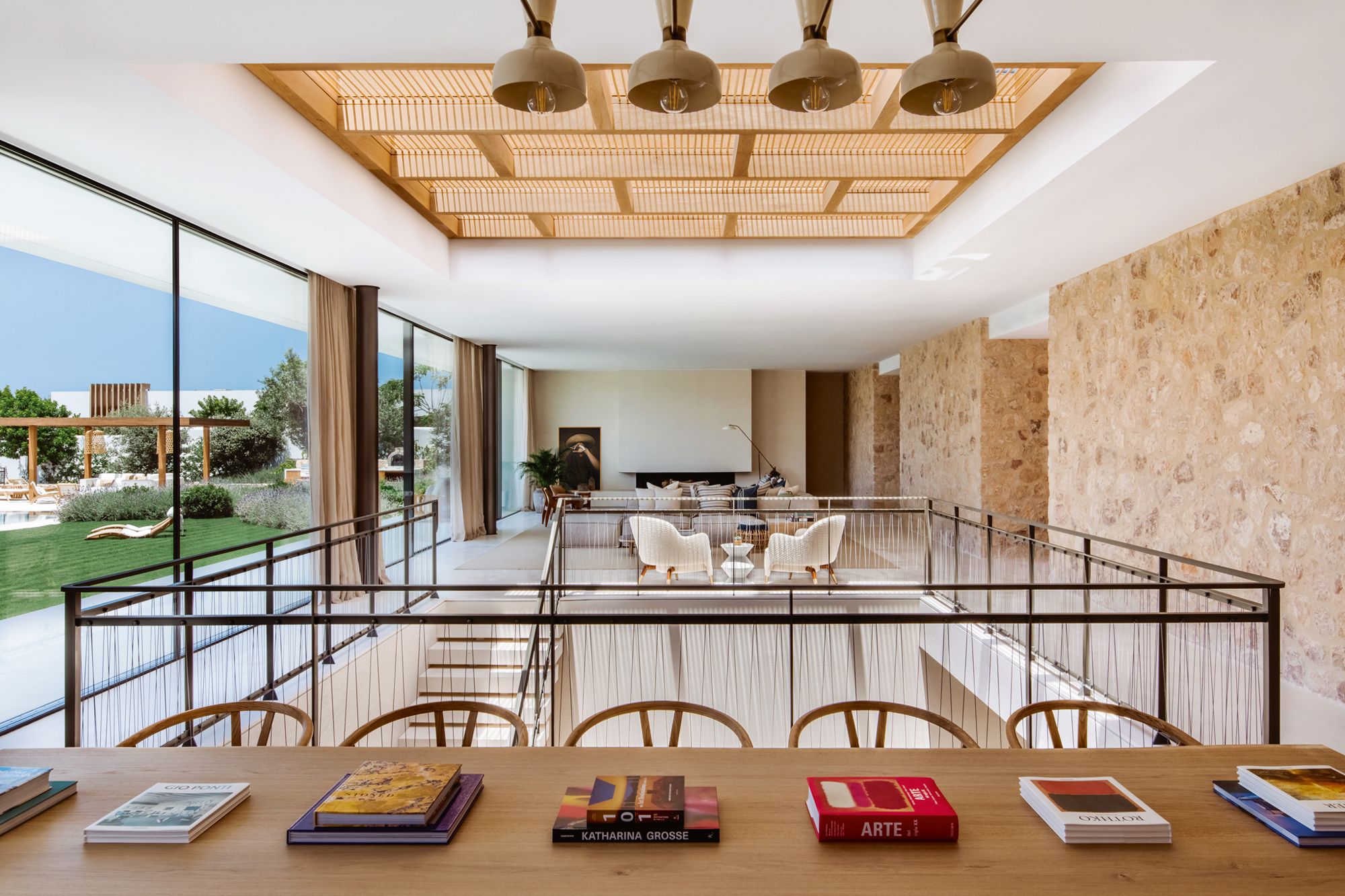 Full-length sliding glass doors makes the interior a seamless part of the garden