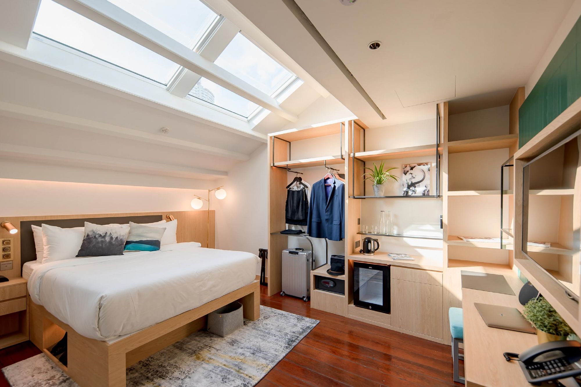 Luxurious and stylish, the deluxe room features two skylights that allows ample natural light to flood the space