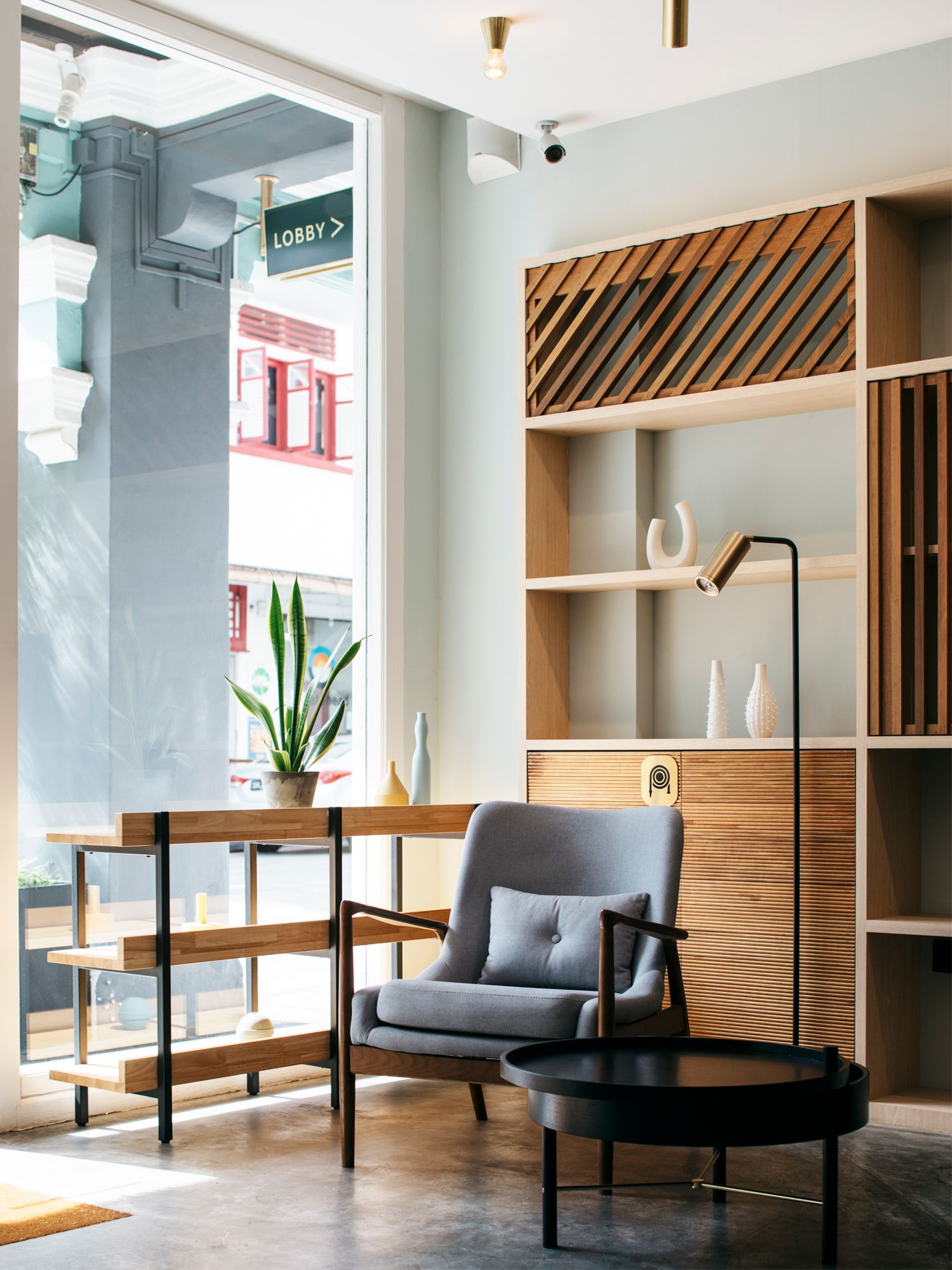 The contemporary lobby of KeSa House exudes an inviting atmosphere with its soft furnishings