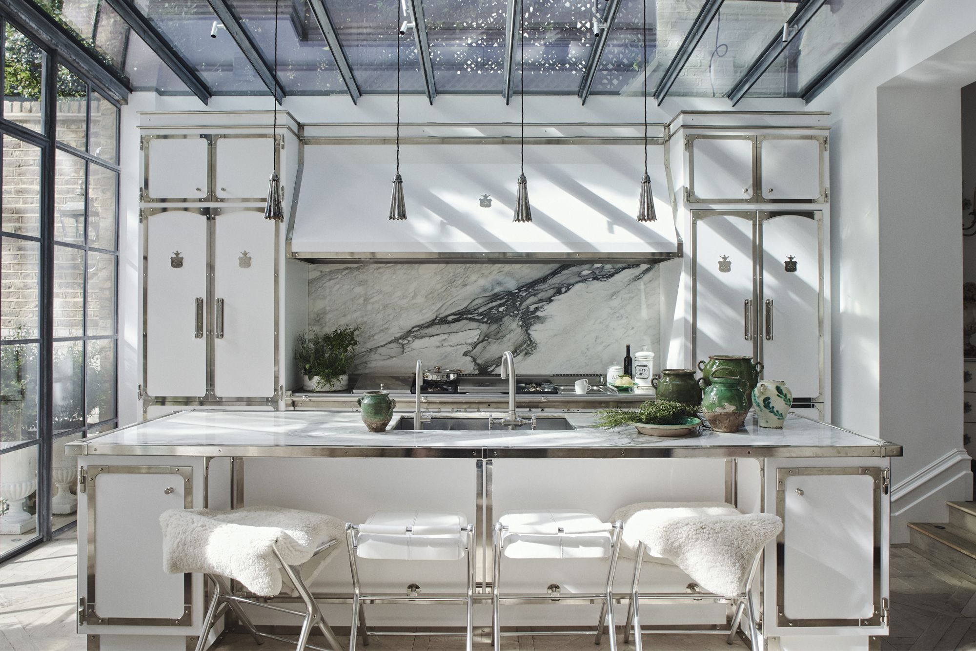 The chic white kitchen is a collaboration between Henry and Italian kitchen manufacturer Officine Gullo