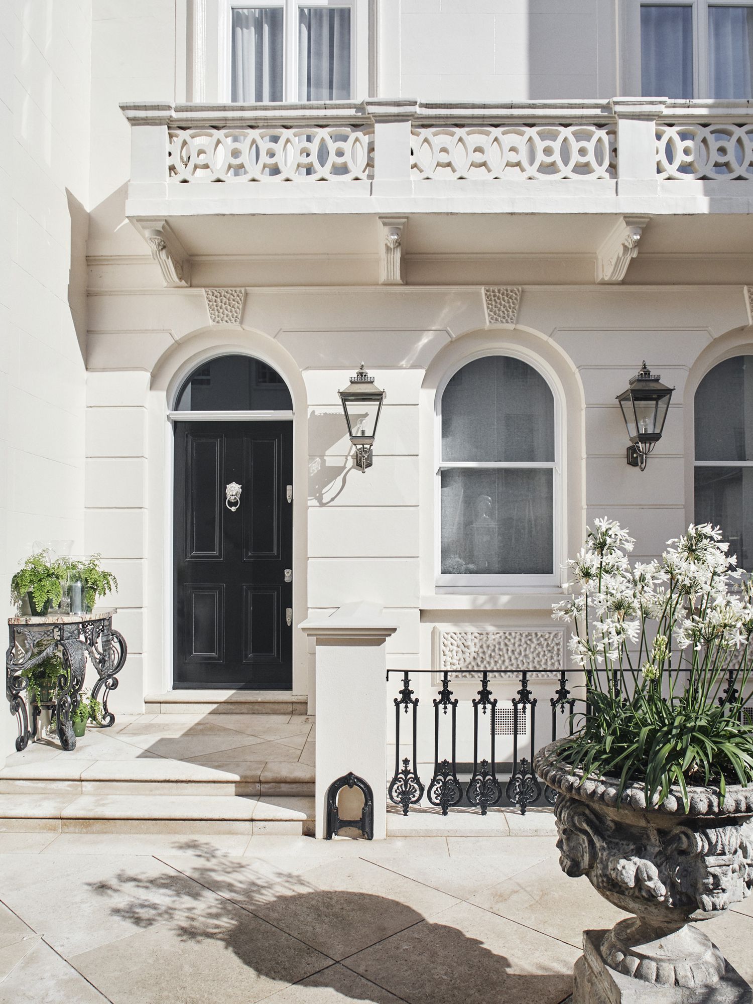 The peaceful white facade of the townhouse is an exciting hint of what's to come