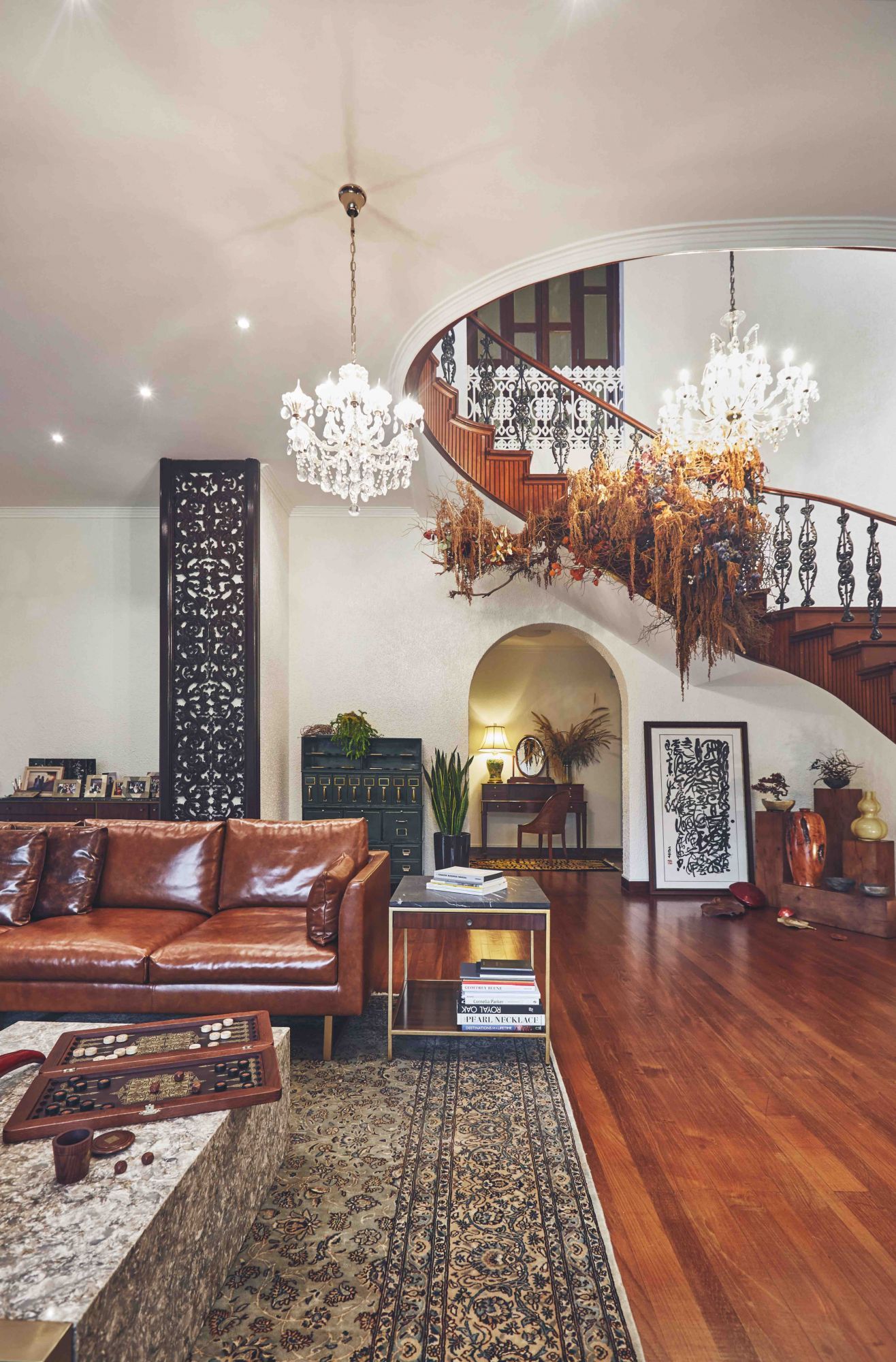 Fashion designer Elyn Wong's tasteful home is filled with a tasteful composition of vintage antique pieces and art