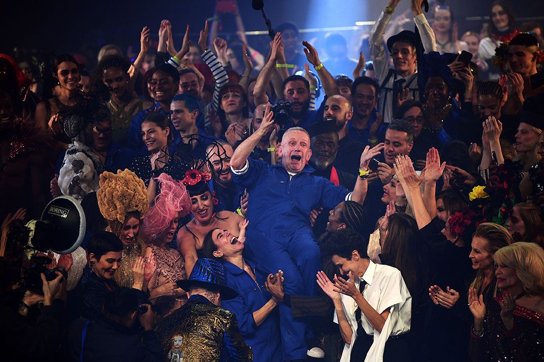 French designer Jean Paul Gaultier (C) celebrates with models at the end of his Women's Spring-Summer 2020 Haute Couture collection fashion show in Paris, on January 22, 2020. - Legendary French designer Jean-Paul Gaultier is set to retire from fashion after a typically spectacular show in Paris on January 22, 2020. The maverick creator stunned fans on January 17, by announcing that the haute couture show in a theatre in the French capital would be his last. (Photo by Anne-Christine POUJOULAT / AFP)