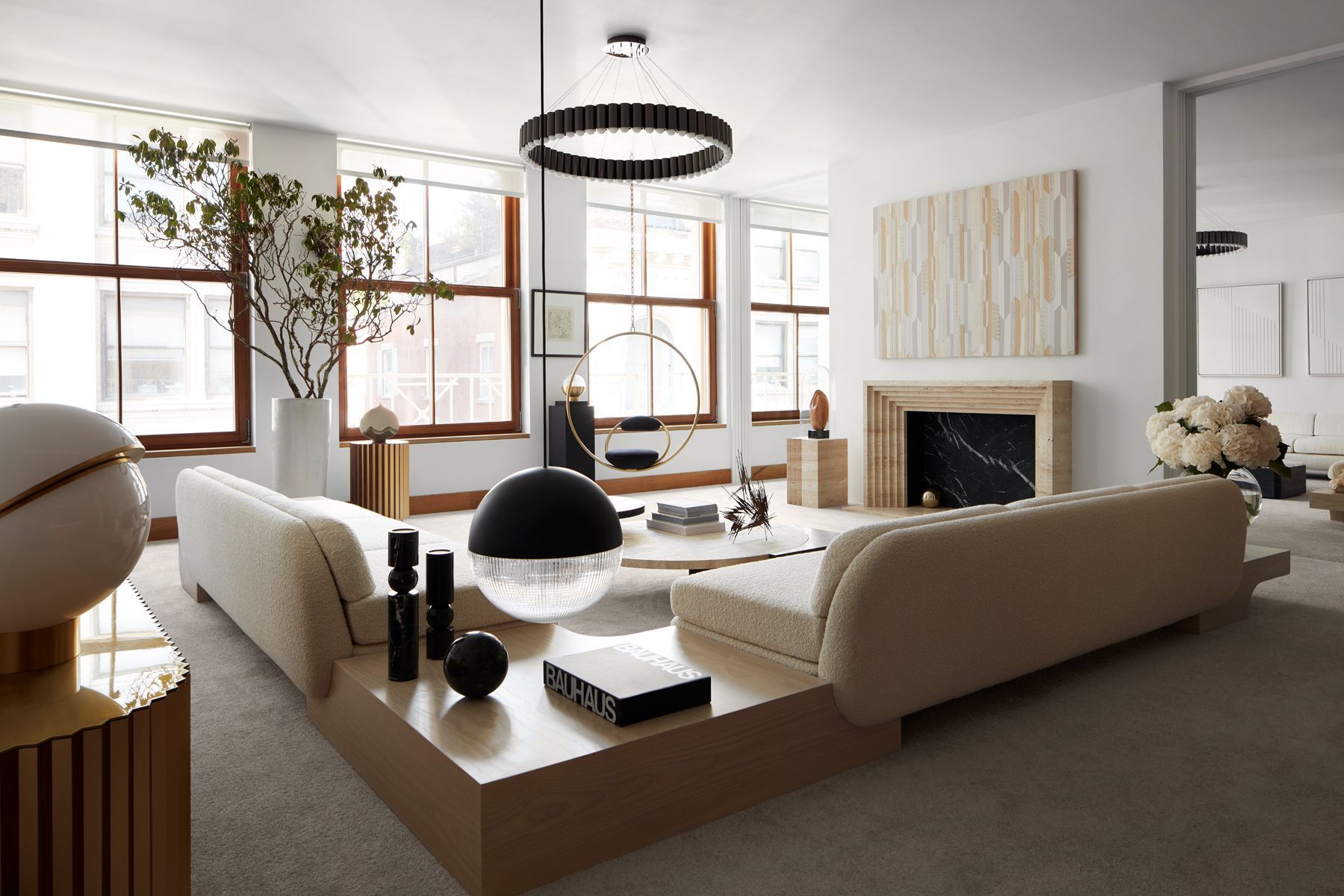 Lee Broom's stylish living room in his New York penthouse highlights a monochromatic palette that's enhanced by textural furnishings